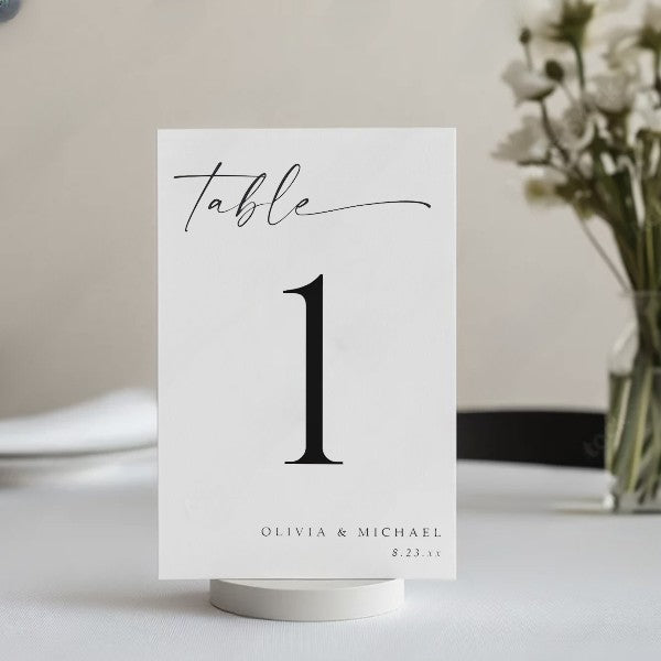 Elegant black and white table number with custom names and date