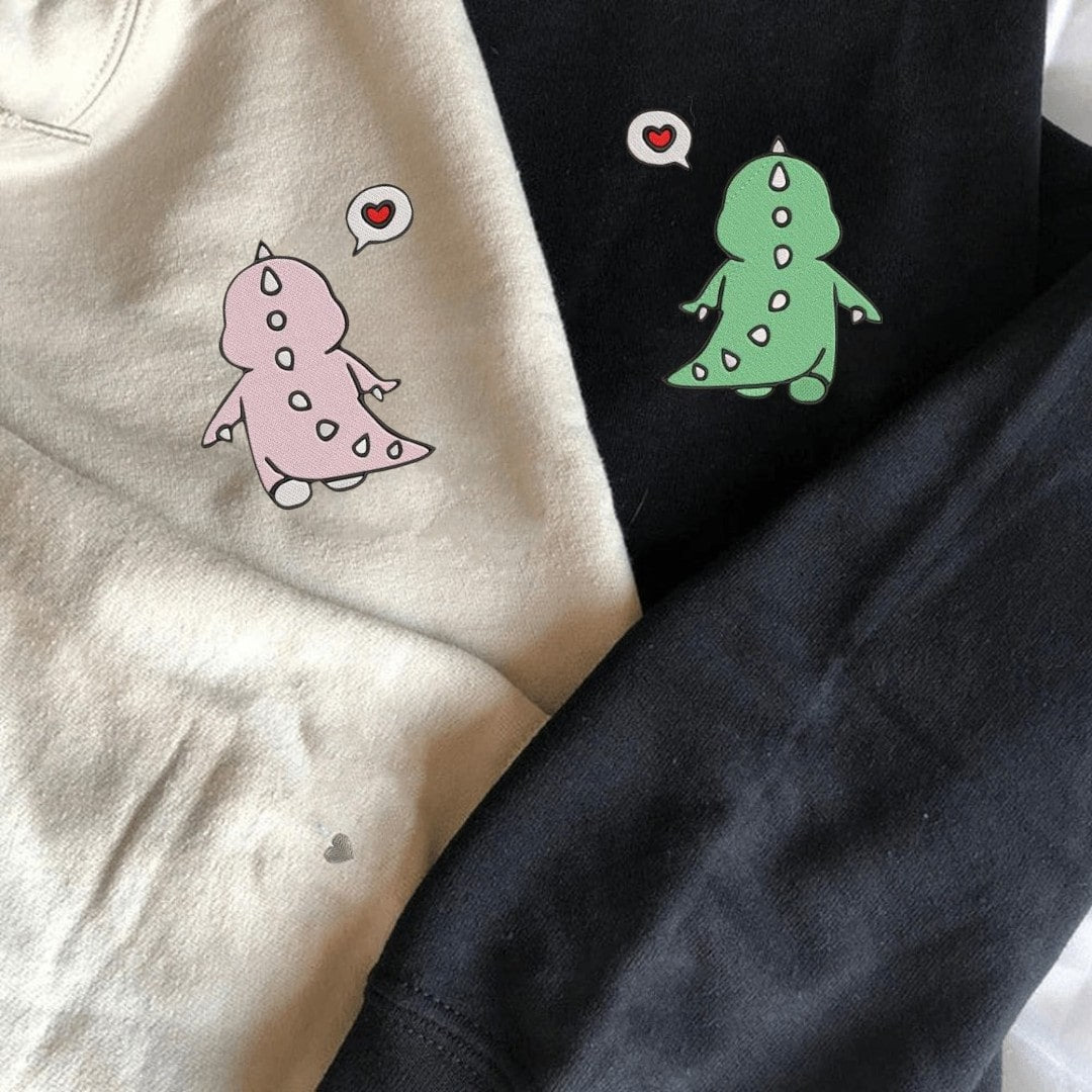 Cozy cotton blend sweaters with matching dinosaur theme.
