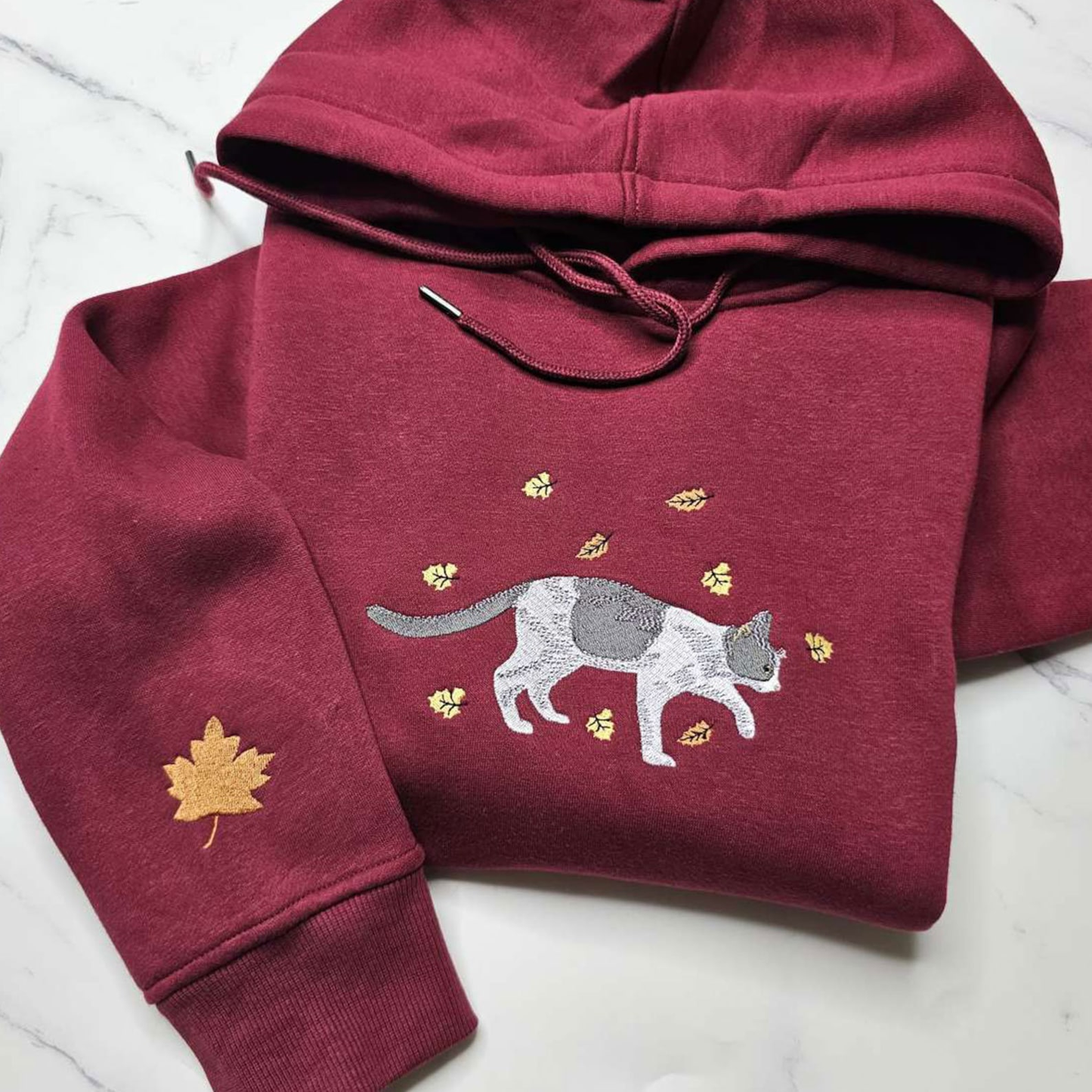 Personalized sweatshirt featuring pet embroidery and fall leaf design - custom embroidered sweatshirts