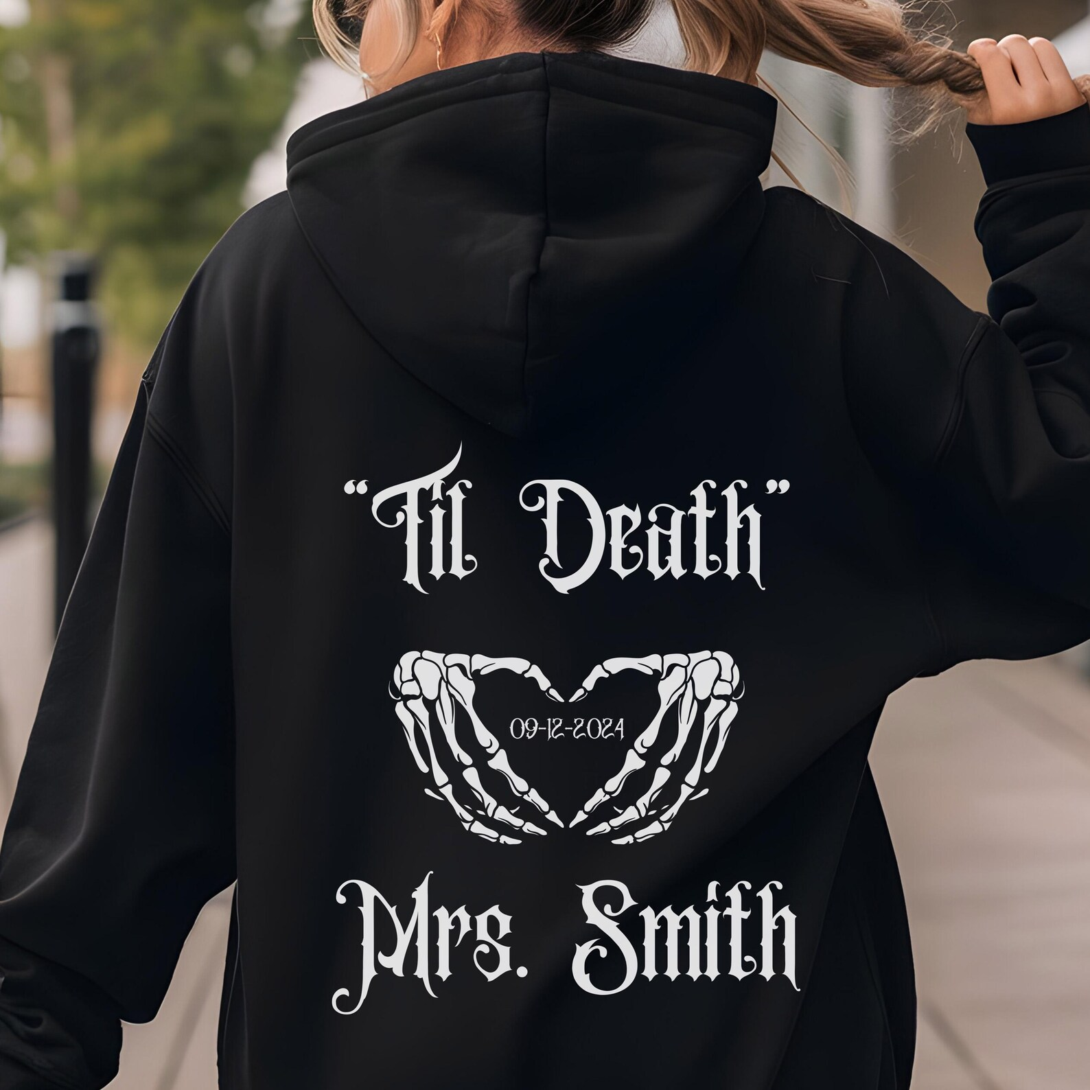 Close-up of gothic-inspired hoodies for couples celebrating love.