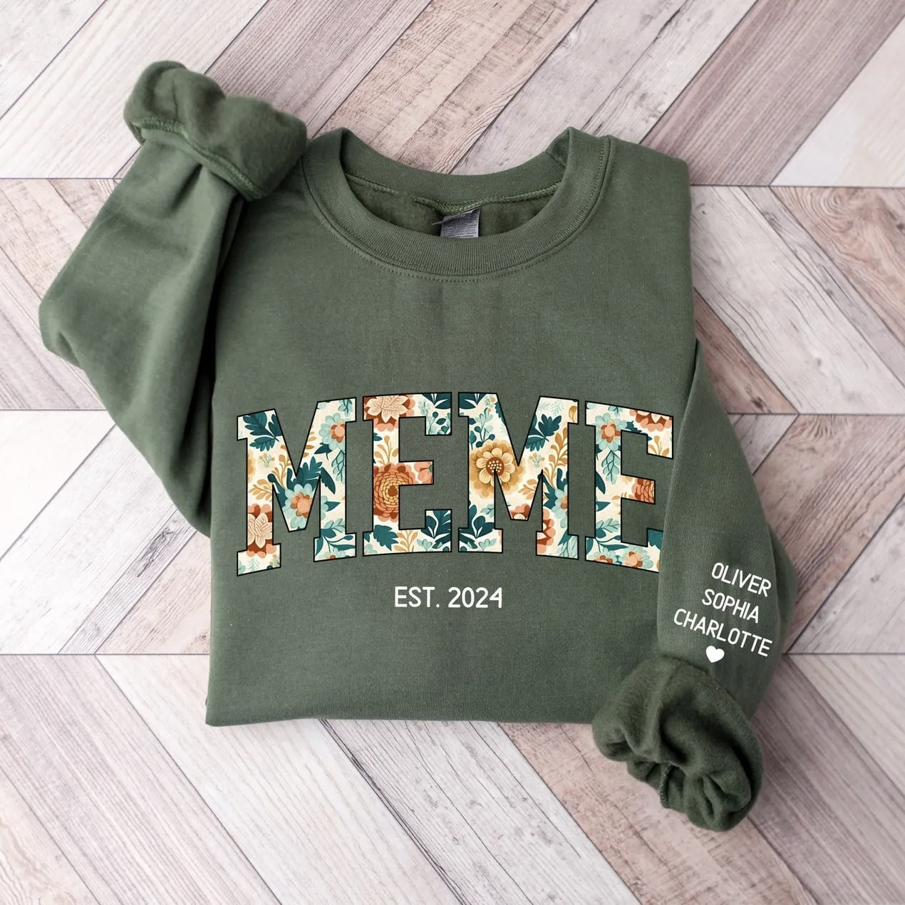 Customizable olive green sweatshirt featuring floral letters and family names.