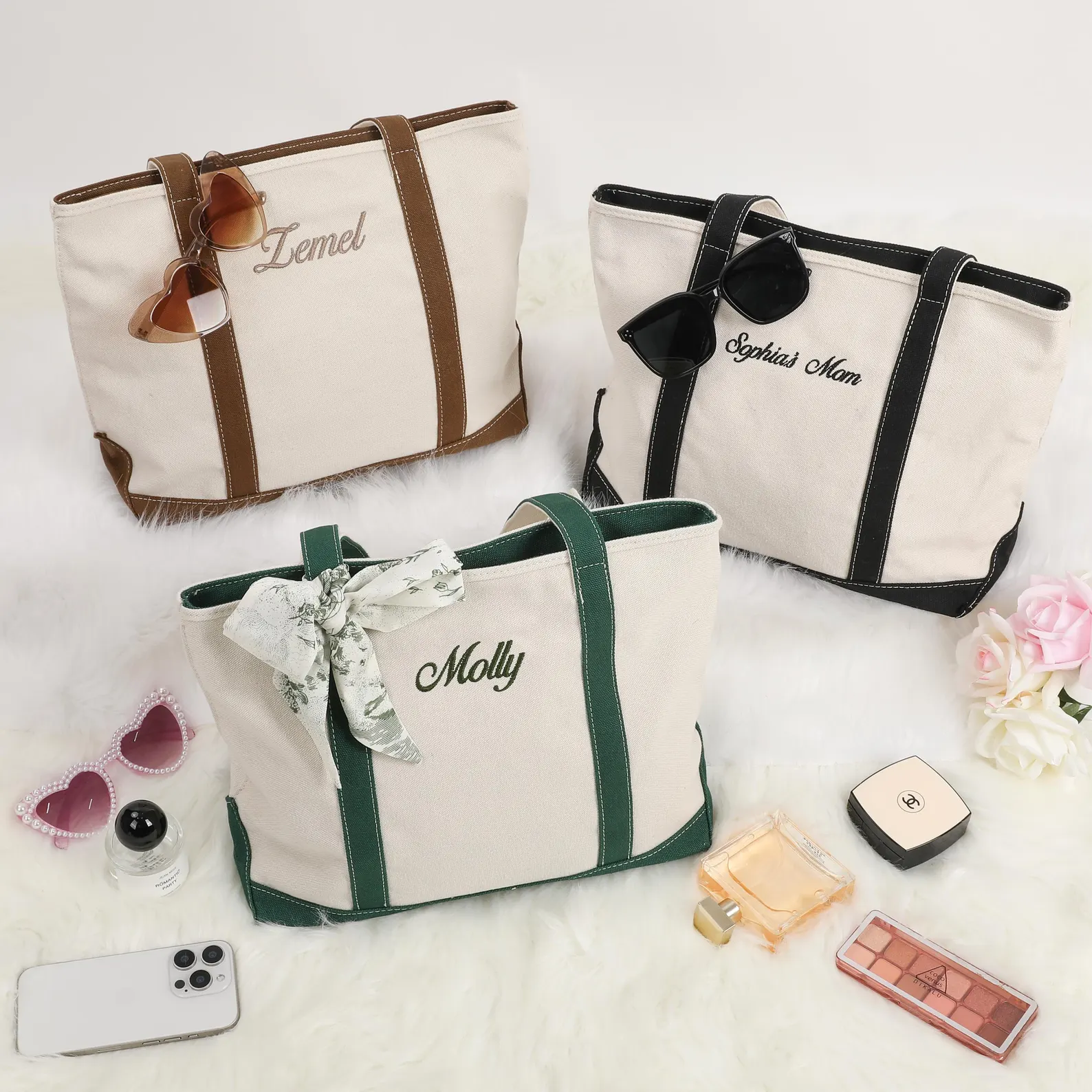 Personalized canvas tote bag with embroidered names in black, khaki, and green.