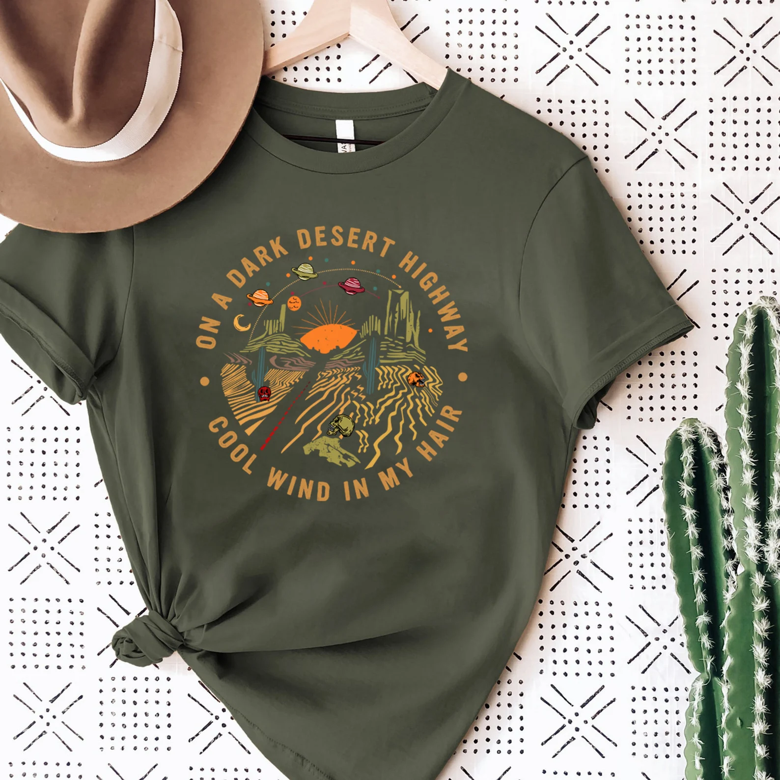 Desert highway graphic on a green t-shirt