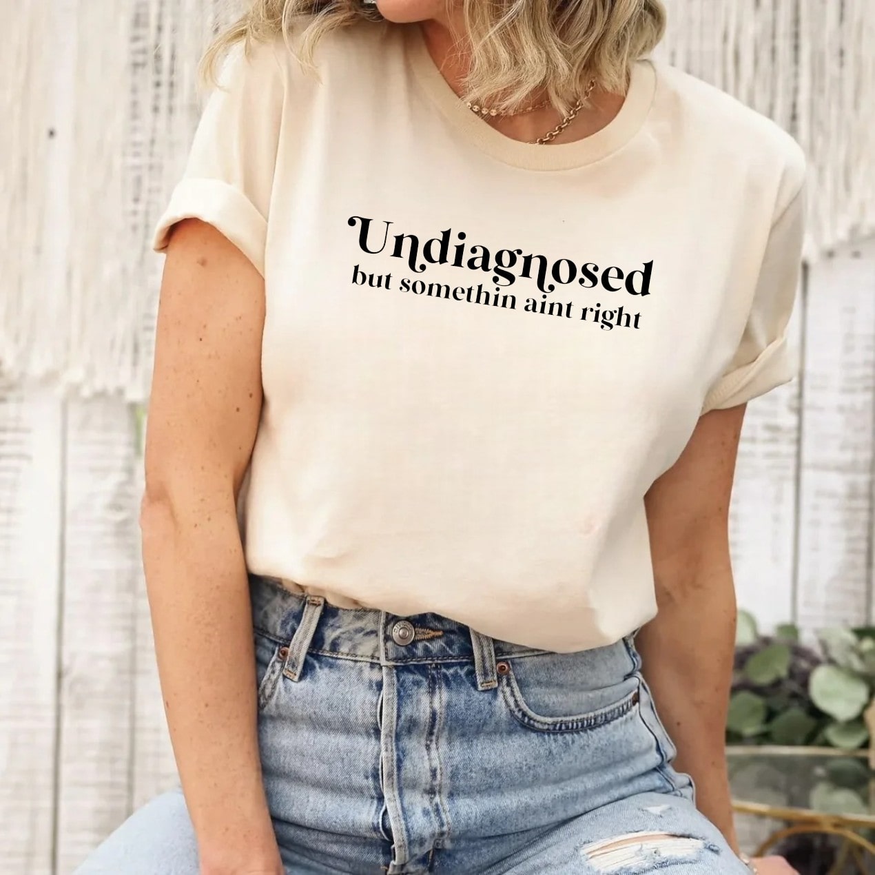 Undiagnosed But Somethin' Ain't Right T-shirt in cream color worn by a woman