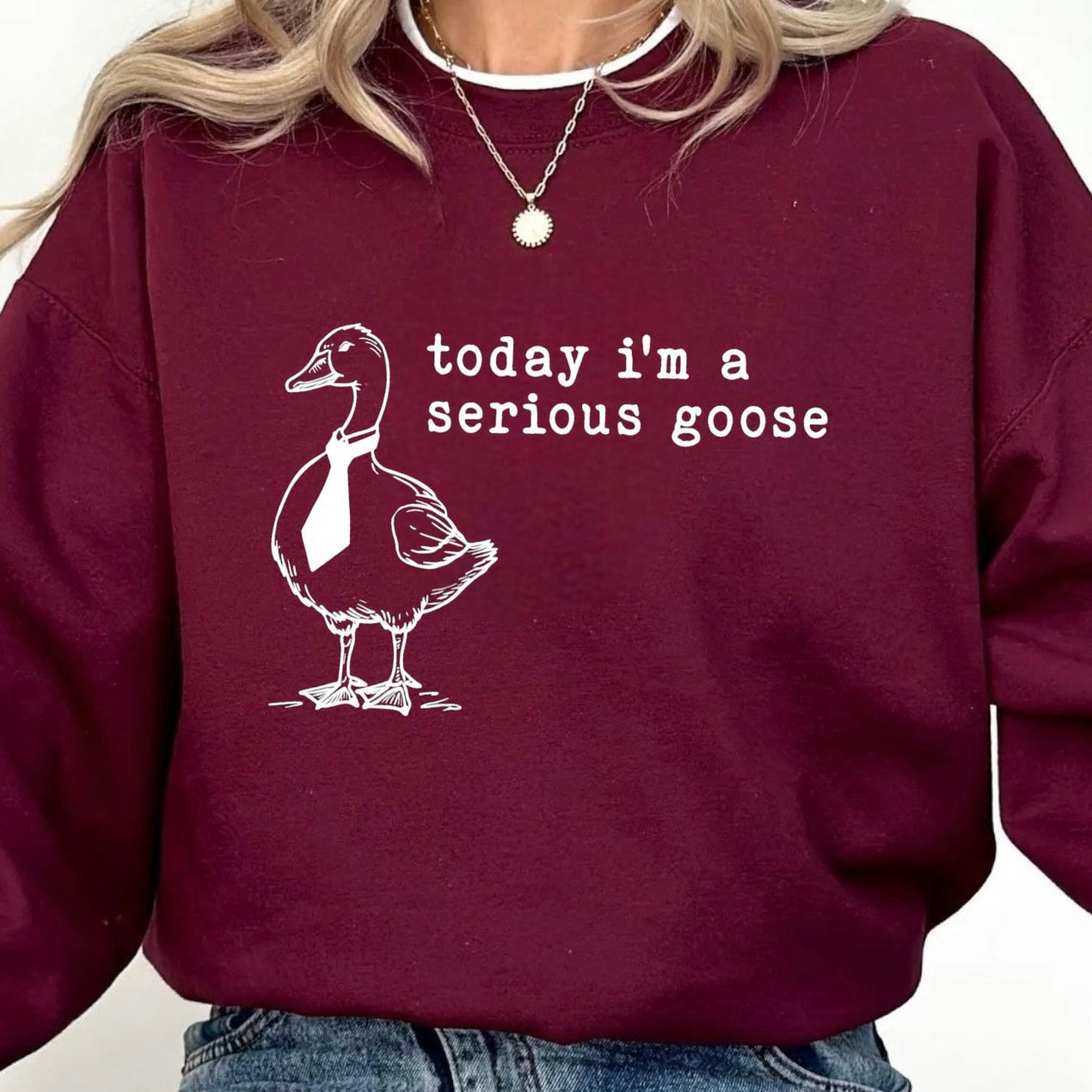 Quirky goose-themed sweatshirt with tie design for humor lovers