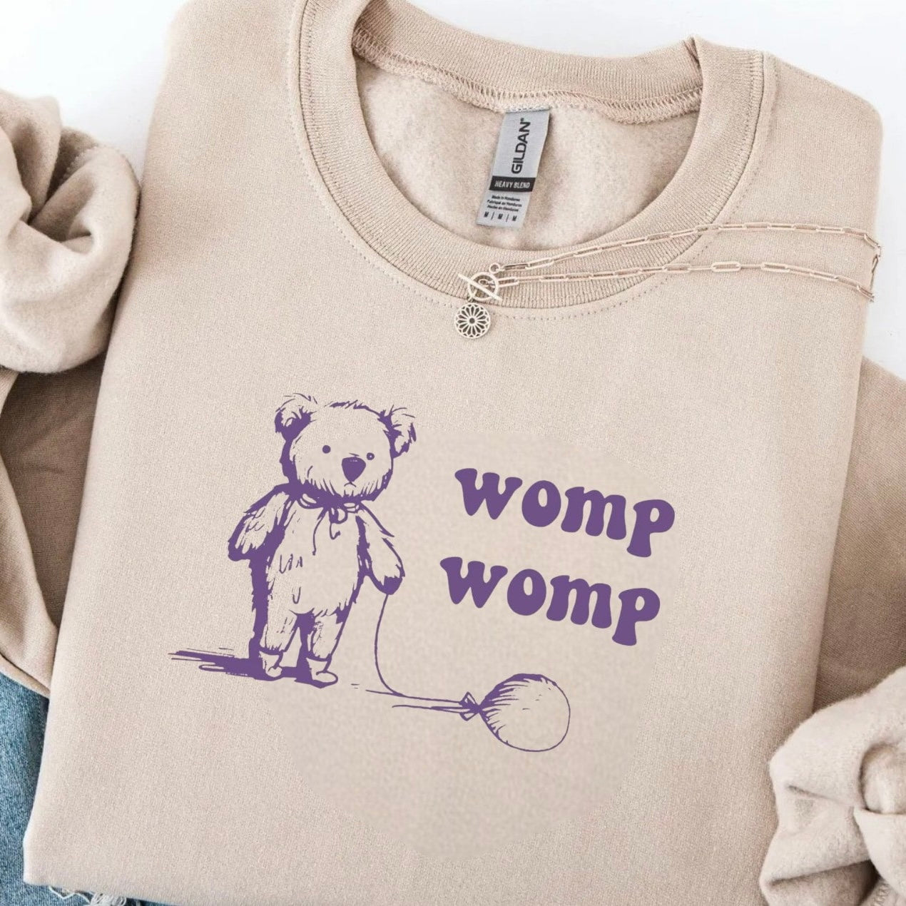 "Womp Womp" bear sweatshirt in soft beige with fun graphic