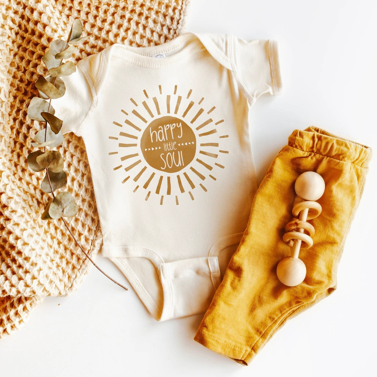 Personalized 'Sunshine Soul' baby onesie with radiant sun design