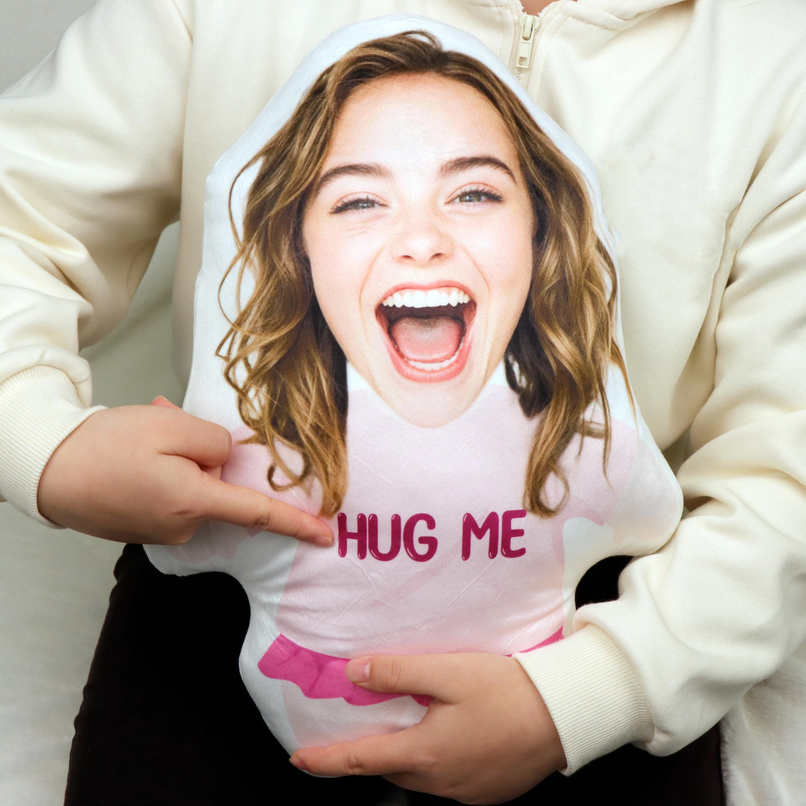 Custom photo pillow featuring a smiling person with "HUG ME" text