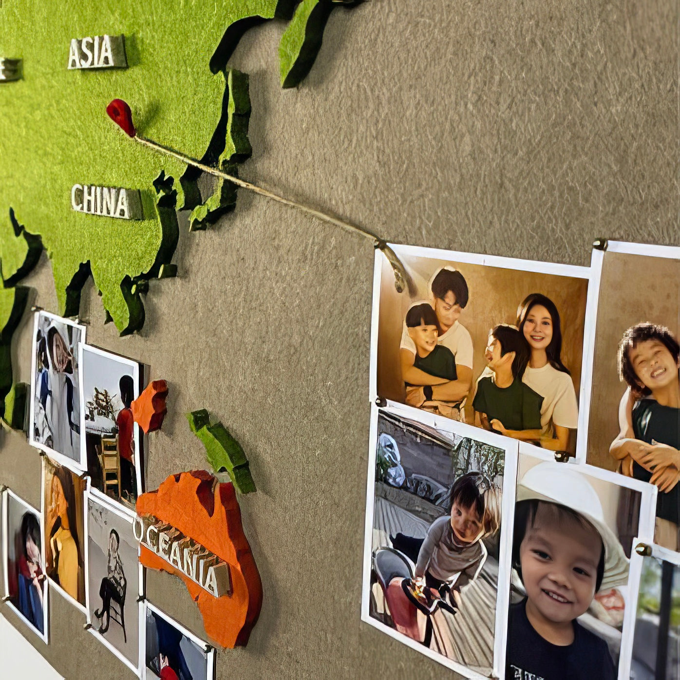 Close-up of the China region with string connecting to photos on the world map.