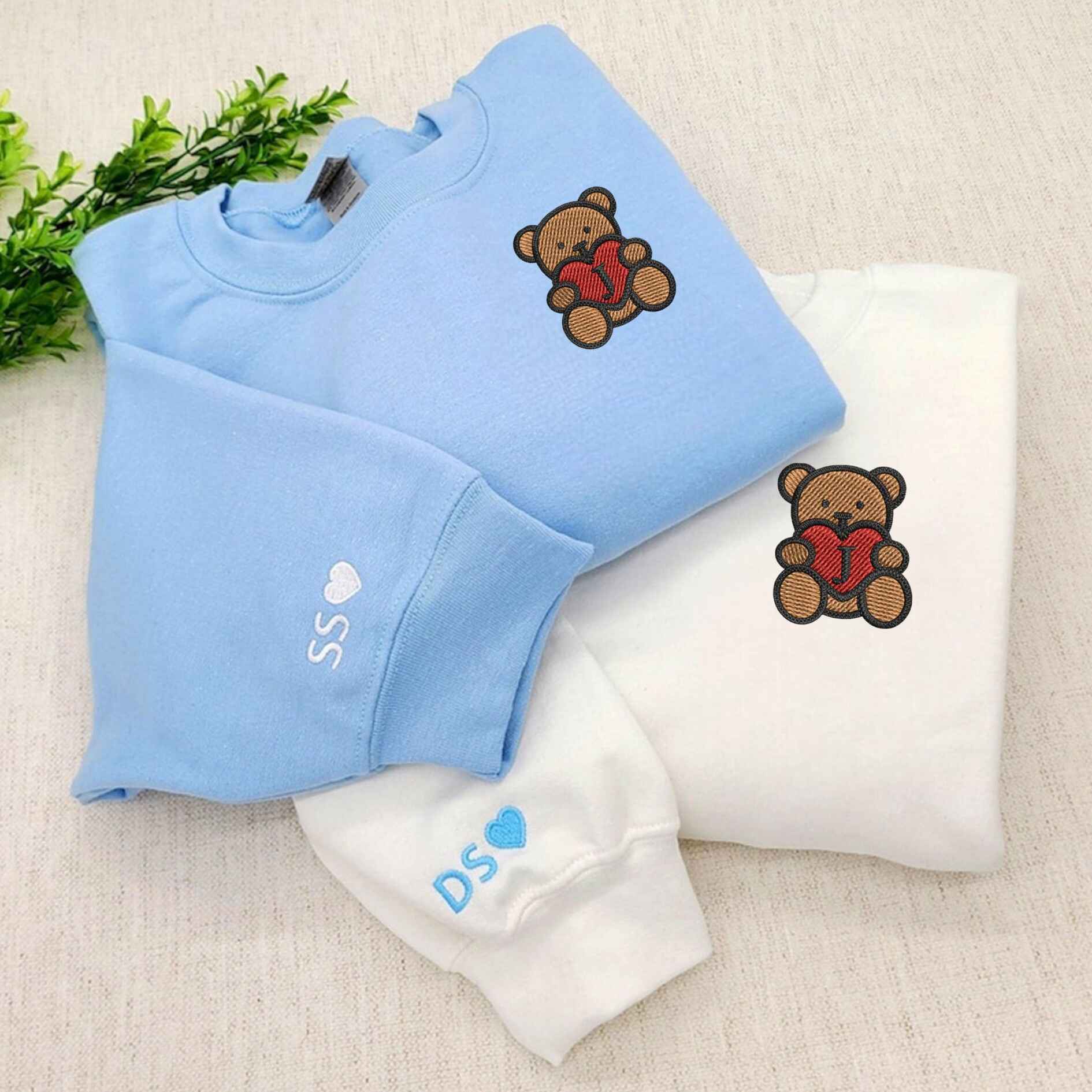 Embroidered couple sweatshirts with teddy bear design and personalized initials
