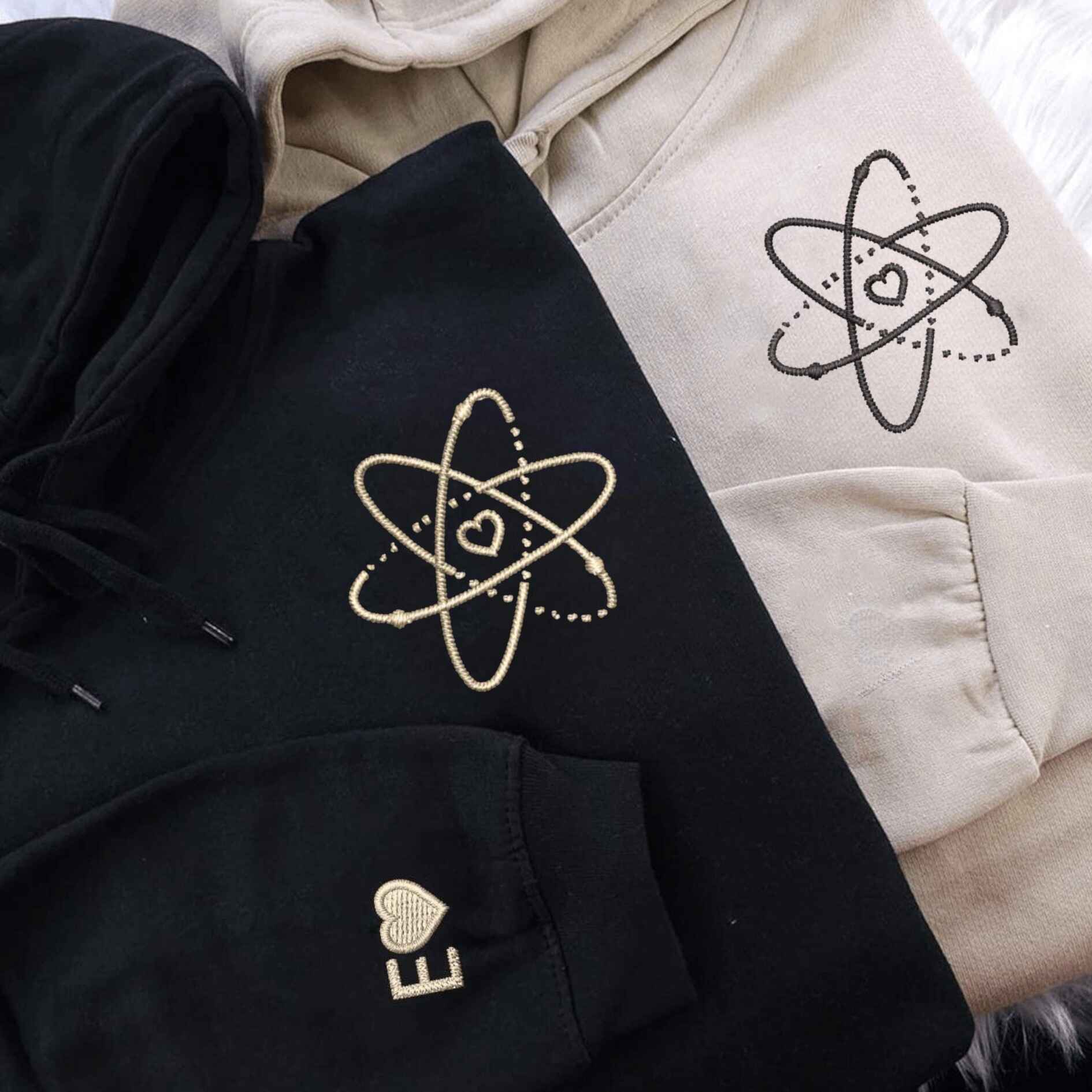 Matching atomic love hoodies with custom initials for couples
