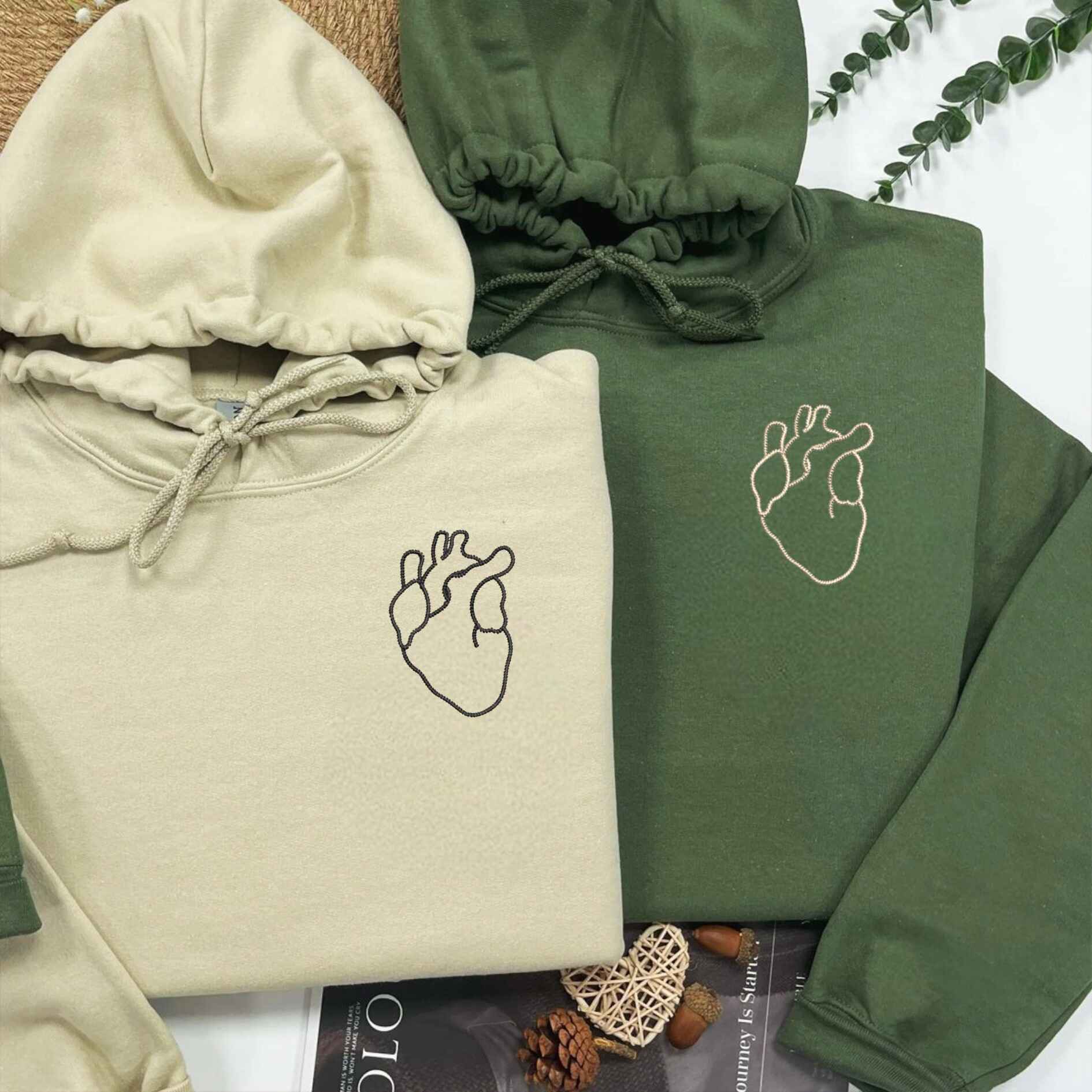 Heart outline embroidered couple hoodies in earthy tones
