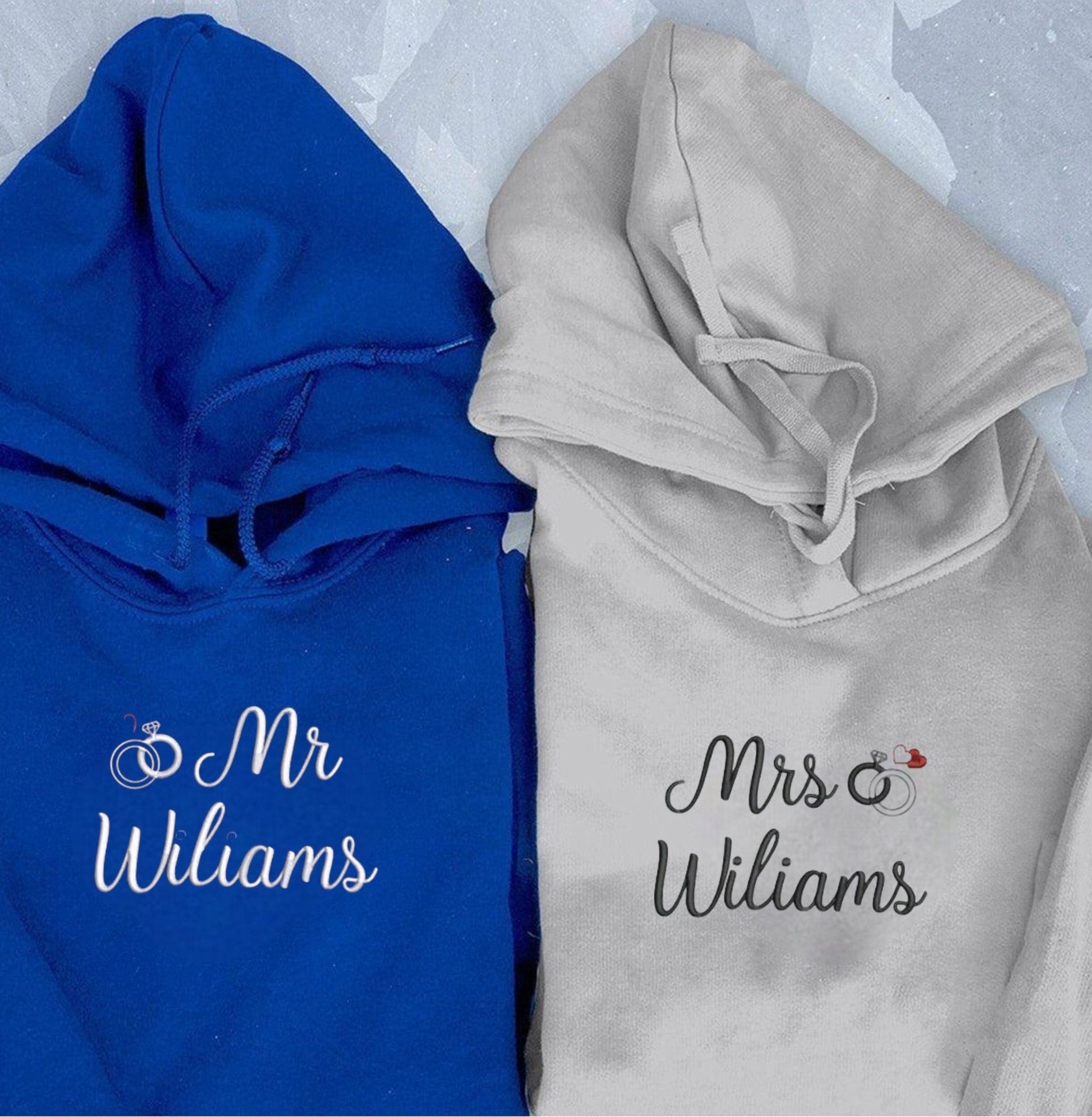 Soft and stylish couple hoodies with symbolic ring designs and embroidered details.