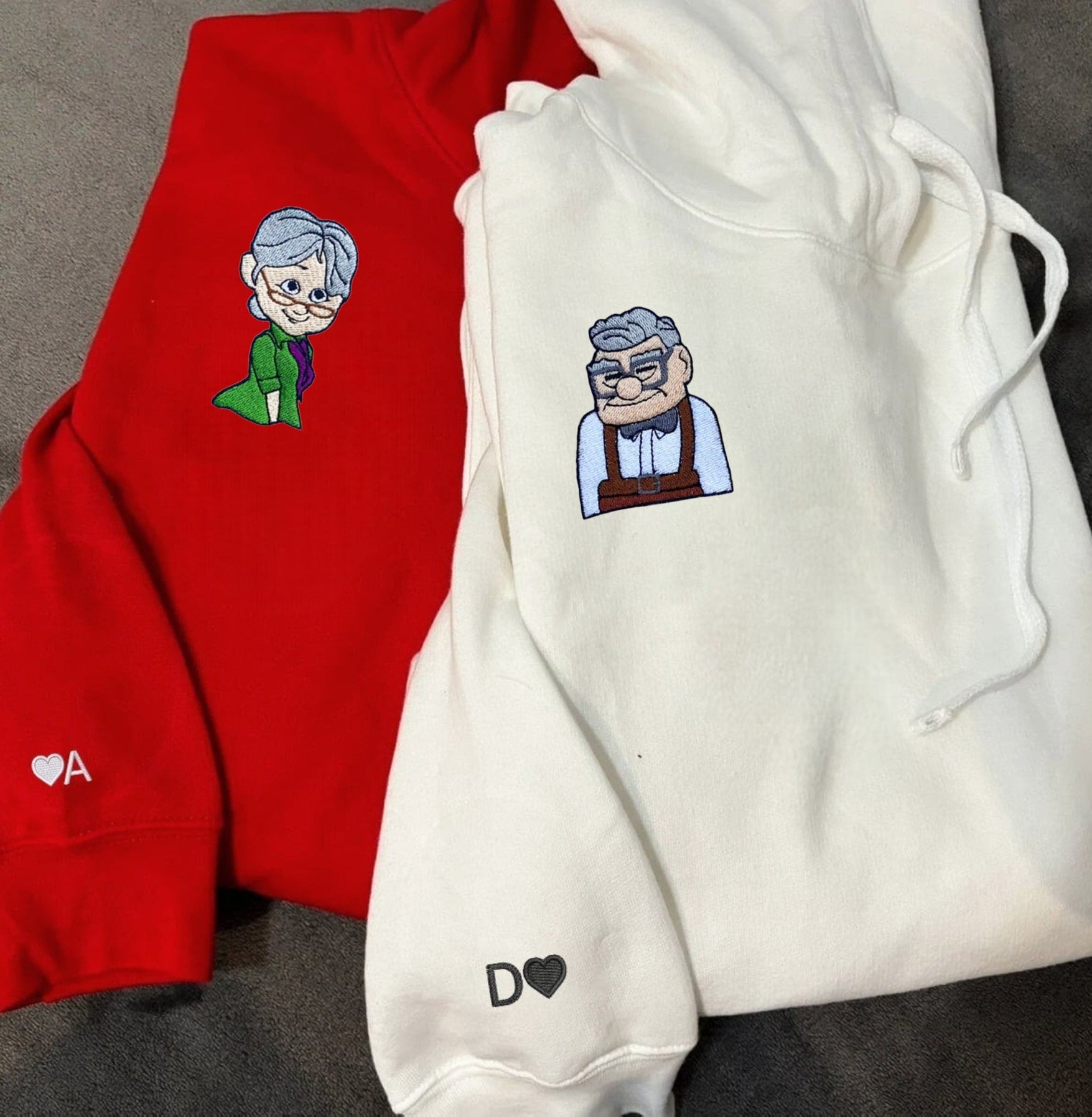 Matching couple hoodies with embroidered movie character designs celebrating timeless love