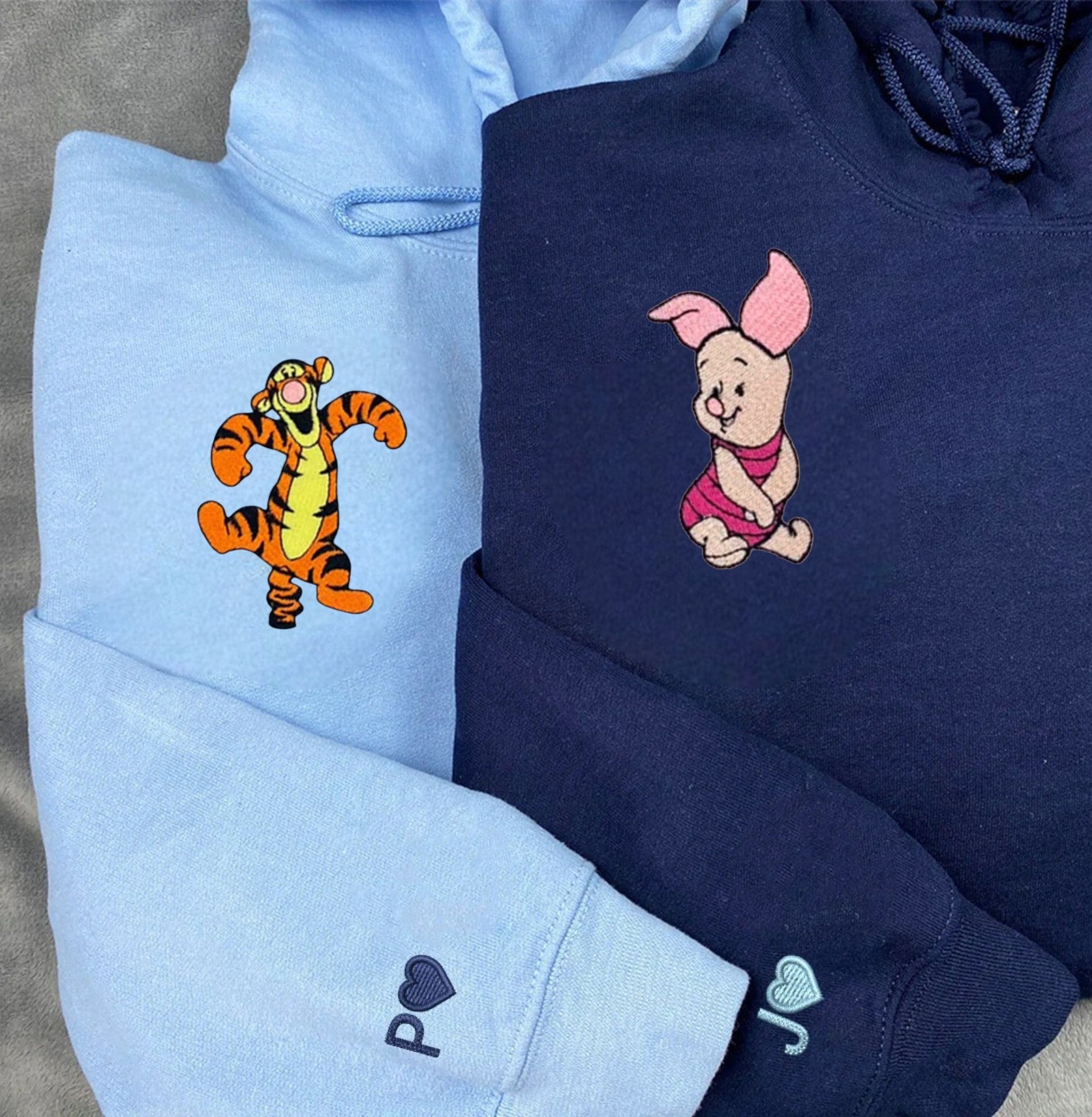 His and Her couple hoodies with charming embroidered details and fun characters.