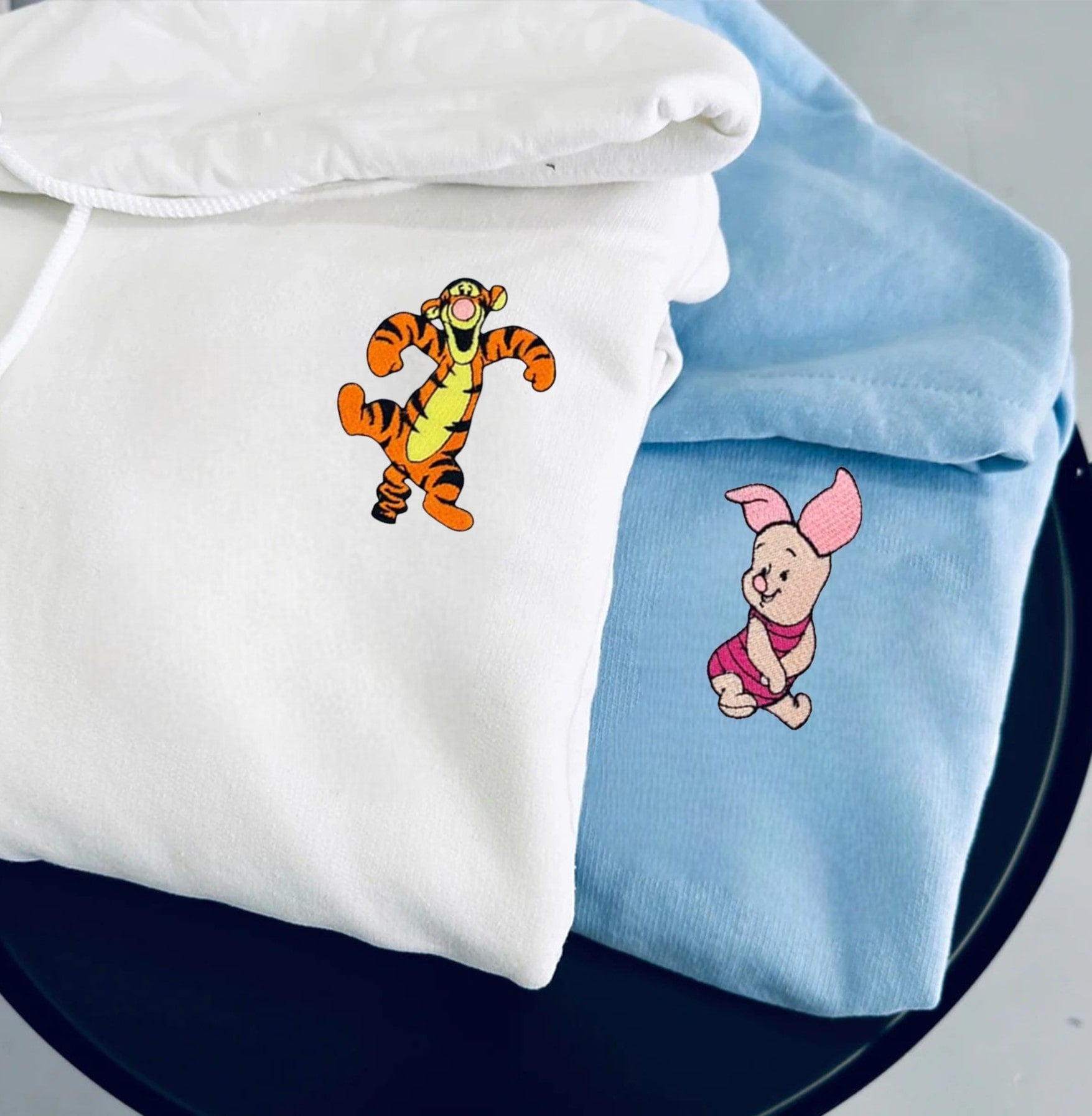 Black and beige Pig and Tiger Couple Hoodies showcasing playful and heartfelt designs.