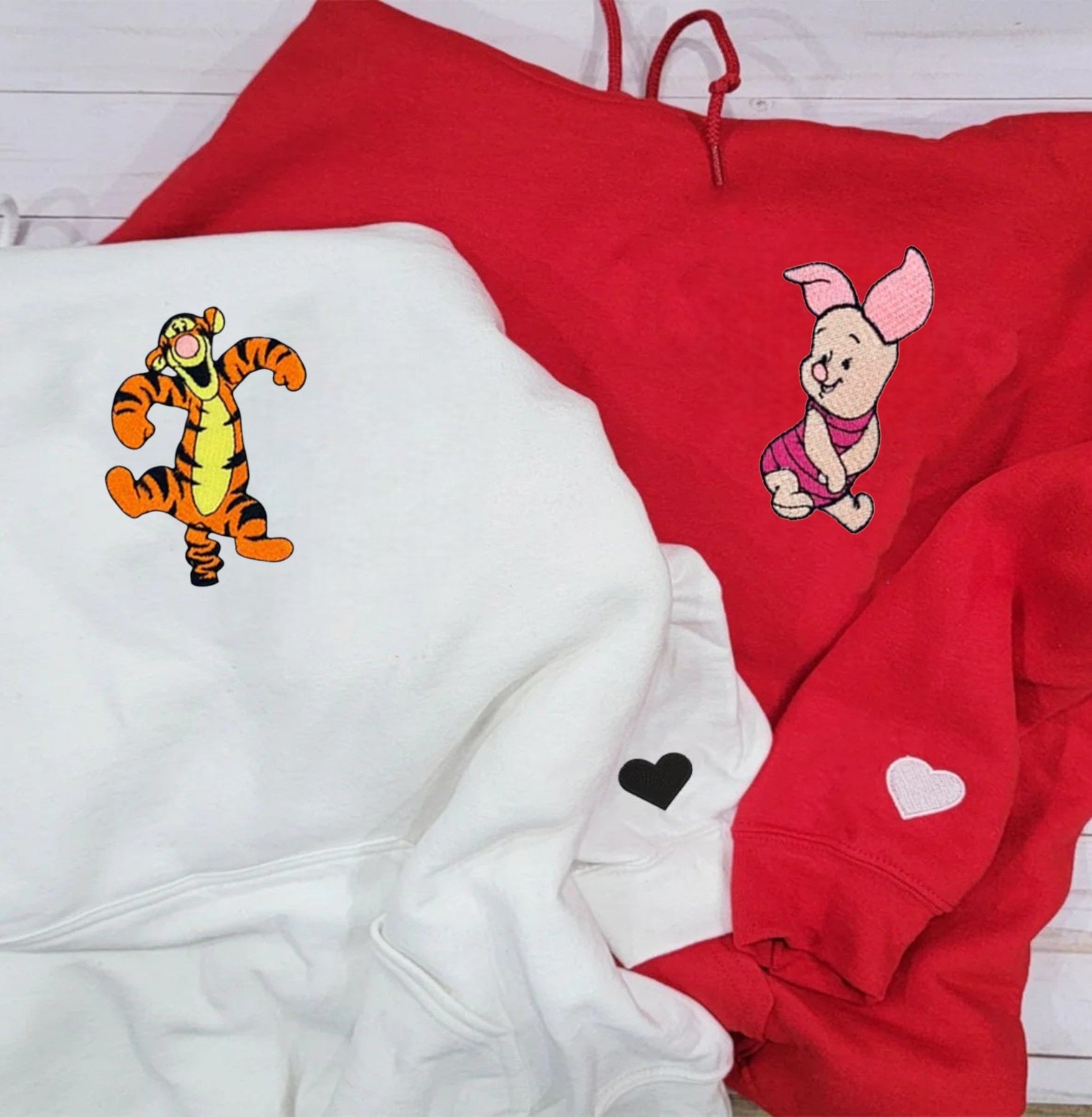 Stylish couple hoodies with embroidered tiger and pig designs, perfect for quirky couples.