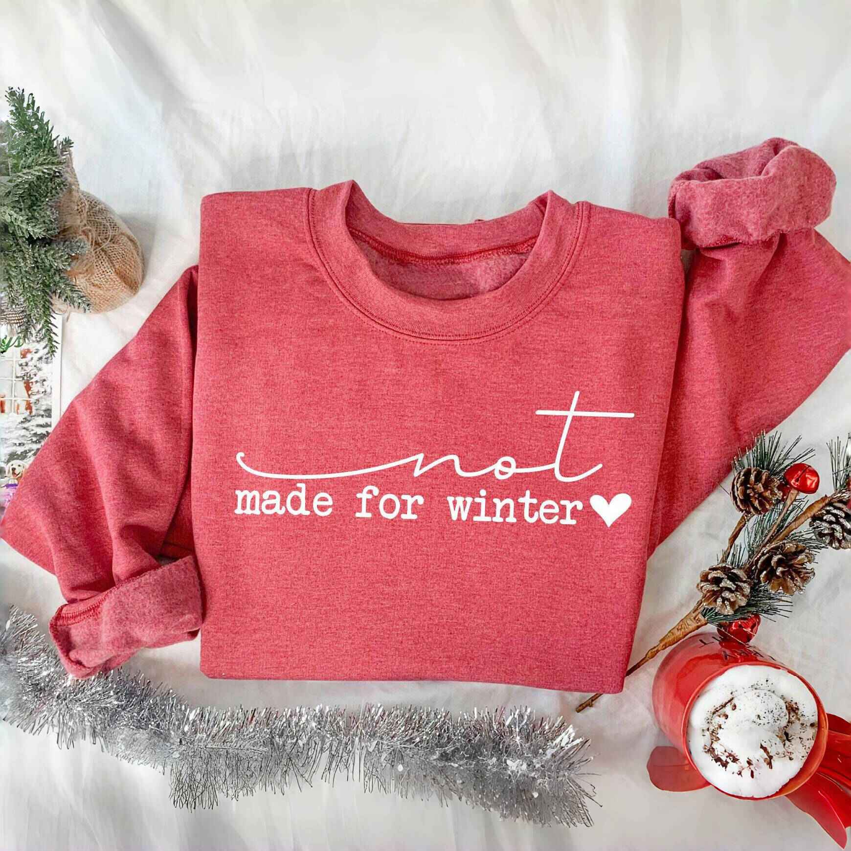 Red "Not Made for Winter" cozy sweatshirt with white lettering
