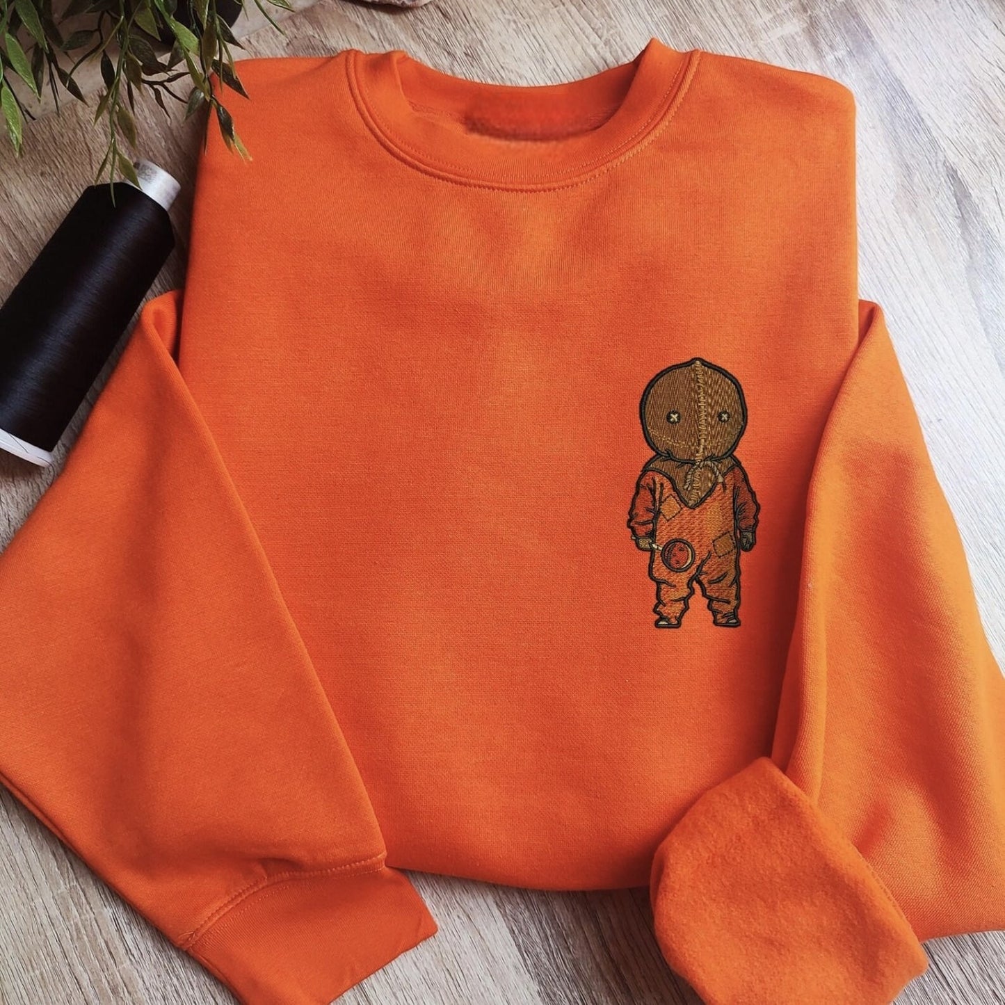 Custom embroidered graphic meme shirts featuring a boy in orange footie pajamas, ideal for best gag gifts for men.
