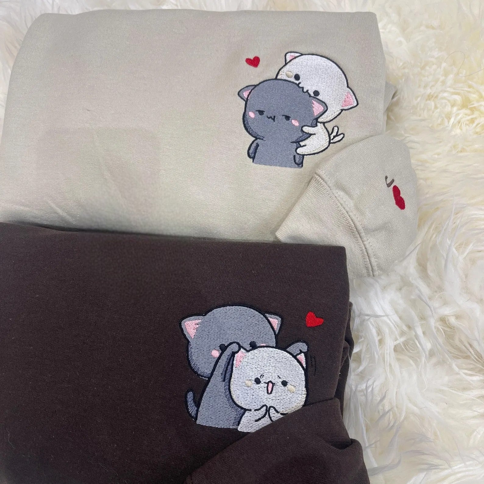 Matching Big Cat and Small Cat embroidered sweatshirts with heart details