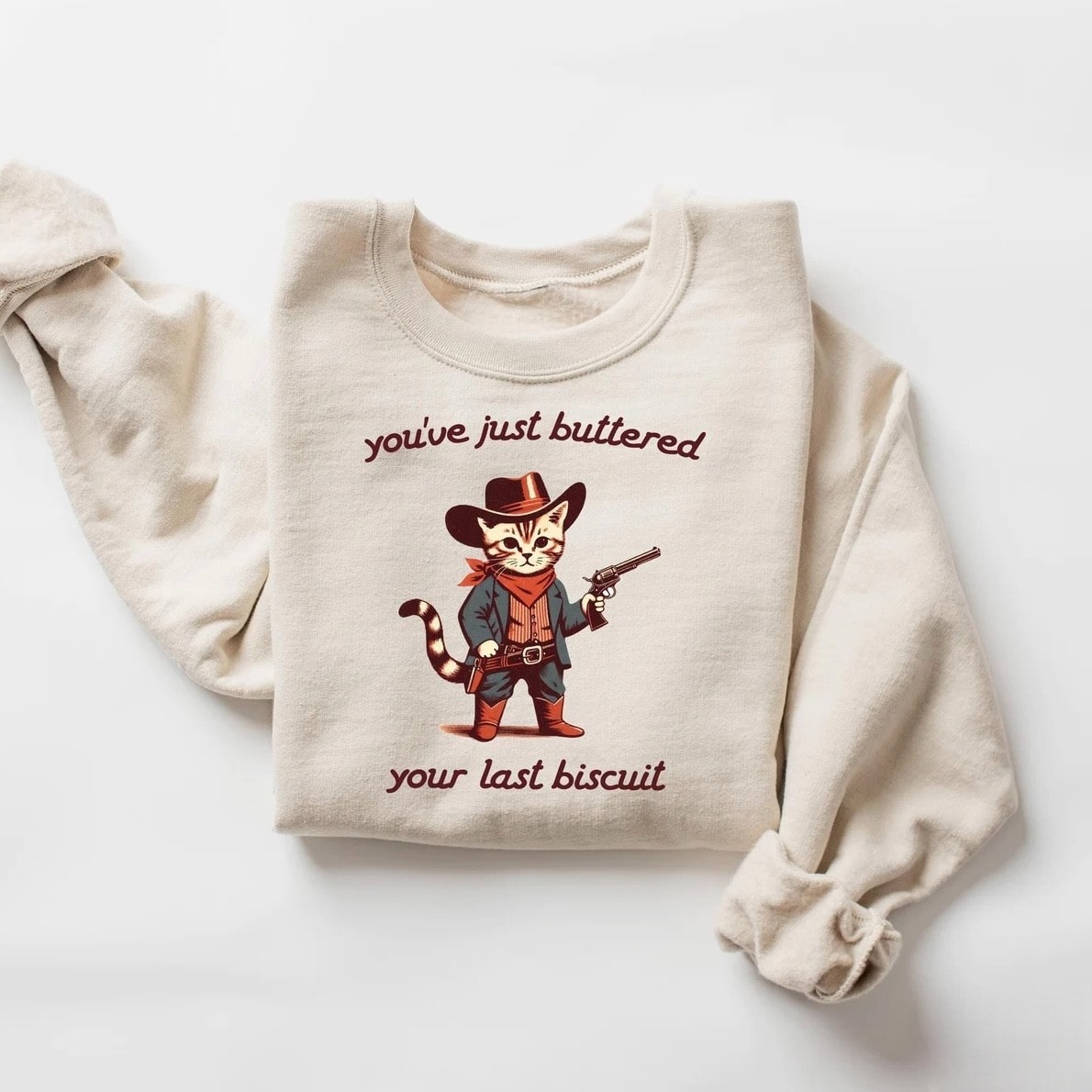 Vintage-inspired cat in cowboy outfit printed on a cozy sweatshirt
