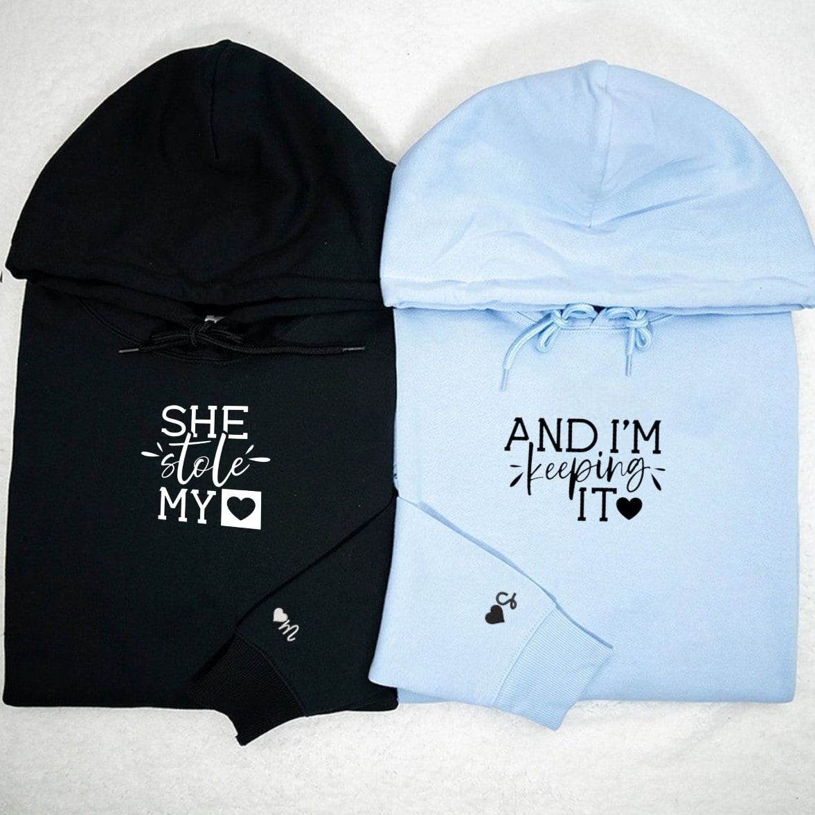 Romantic matching hoodies with "She Stole My Heart" and "And I'm Keeping It" text designs