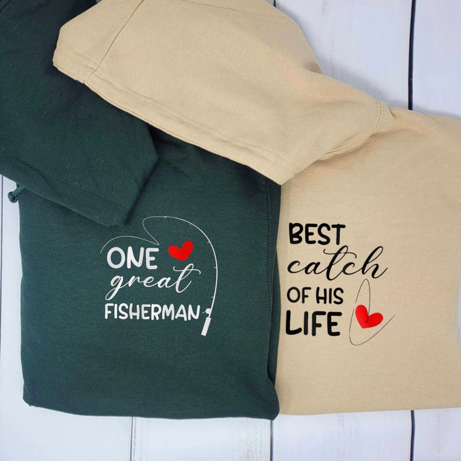 Matching couple hoodies featuring fishing-themed graphics and heart details