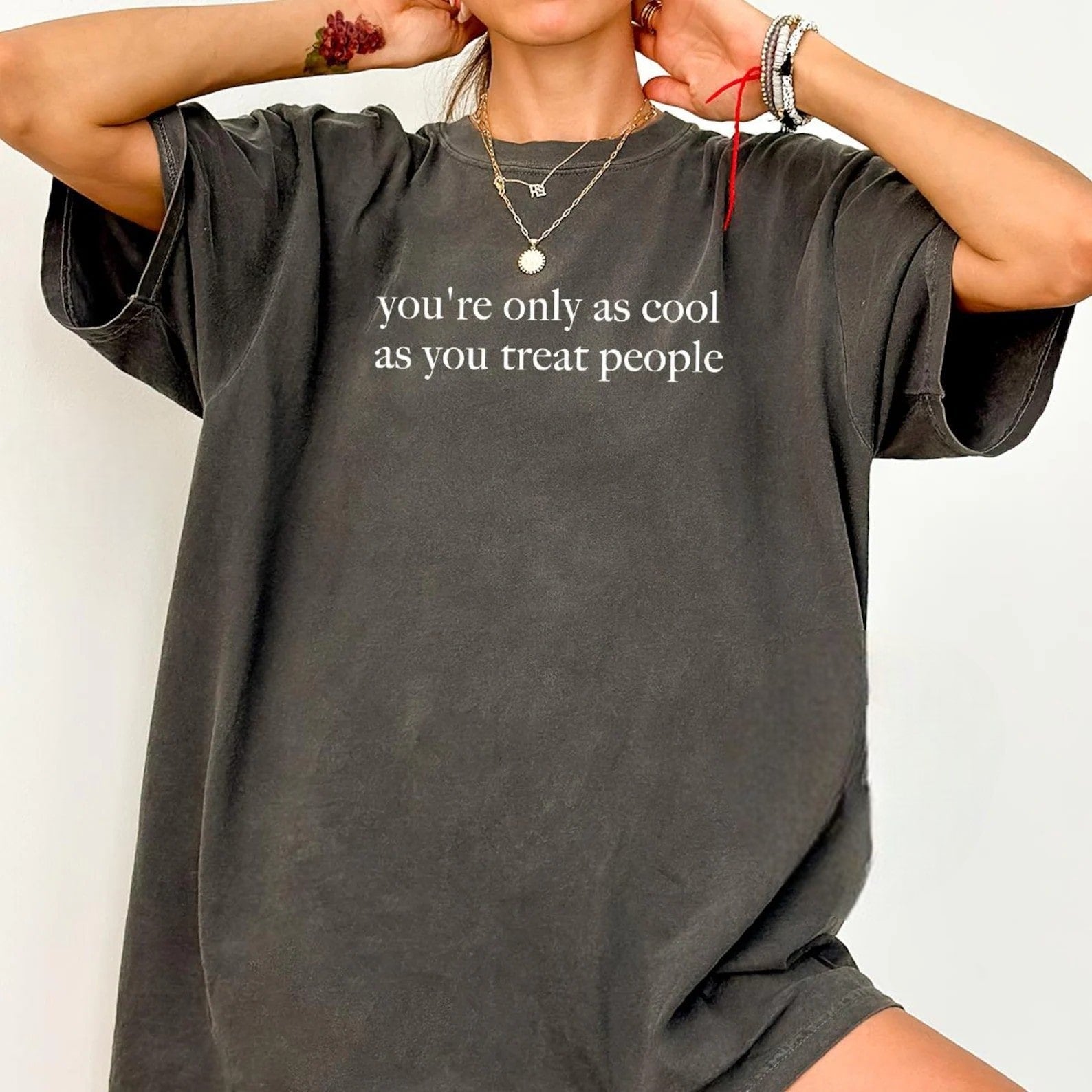 Charcoal oversized graphic tee with kindness message.