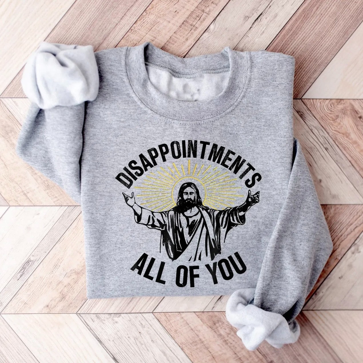 "Disappointments All of You" sweatshirt featuring Jesus with light rays.