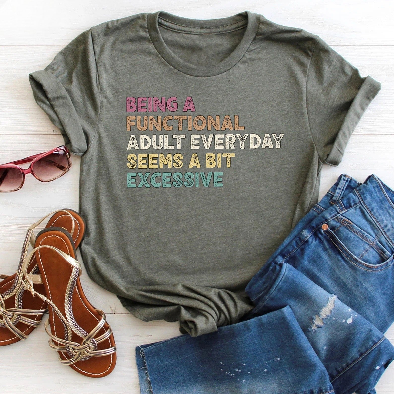 Comfortable olive green t-shirt with humorous adulting statement.