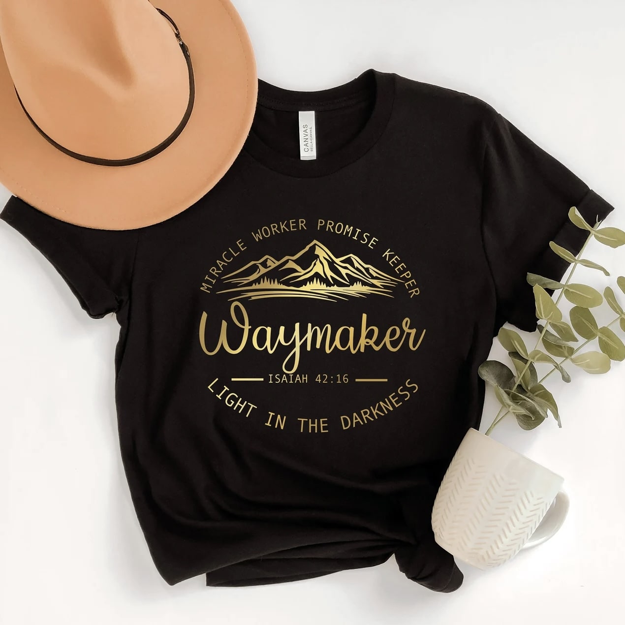 Inspirational "Waymaker" T-shirt in white with stylish accessories.