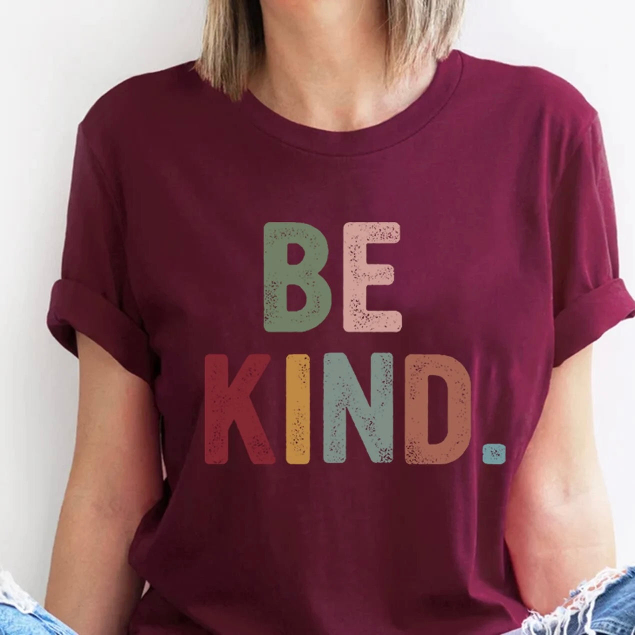 Maroon "Be Kind" graphic tee with bold letters