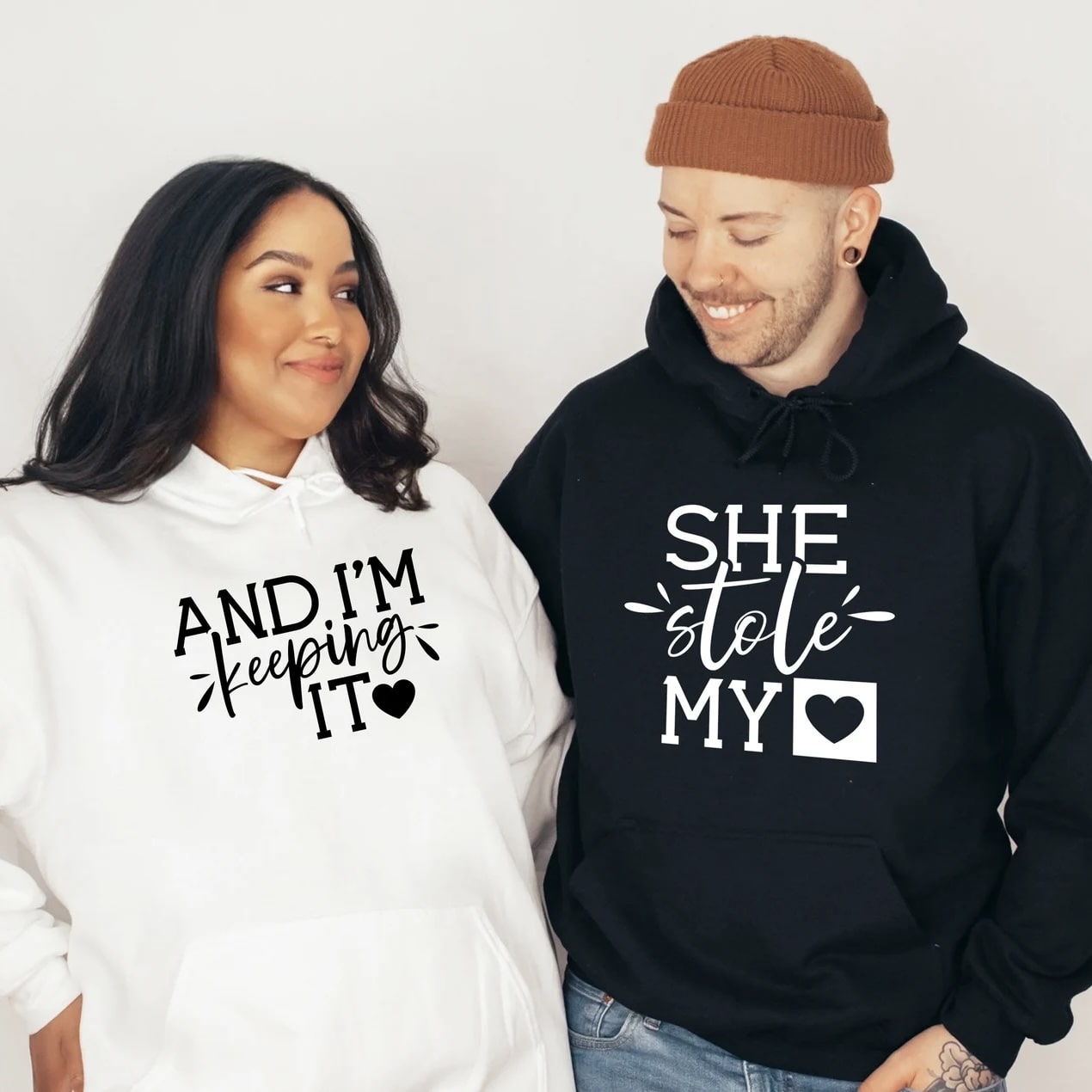 Matching couple hoodies with romantic text designs for couples.