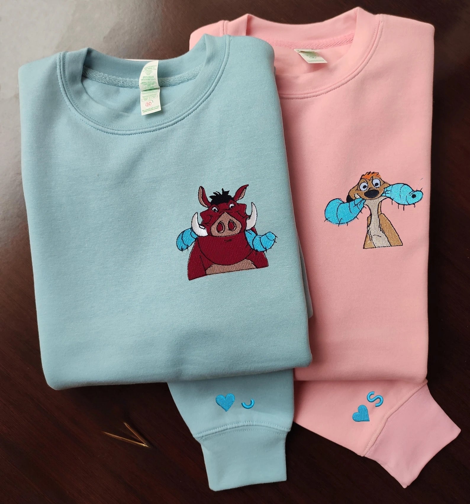 Matching Couple Hoodies featuring couples matching hoodies with Timon and Pumbaa designs.
