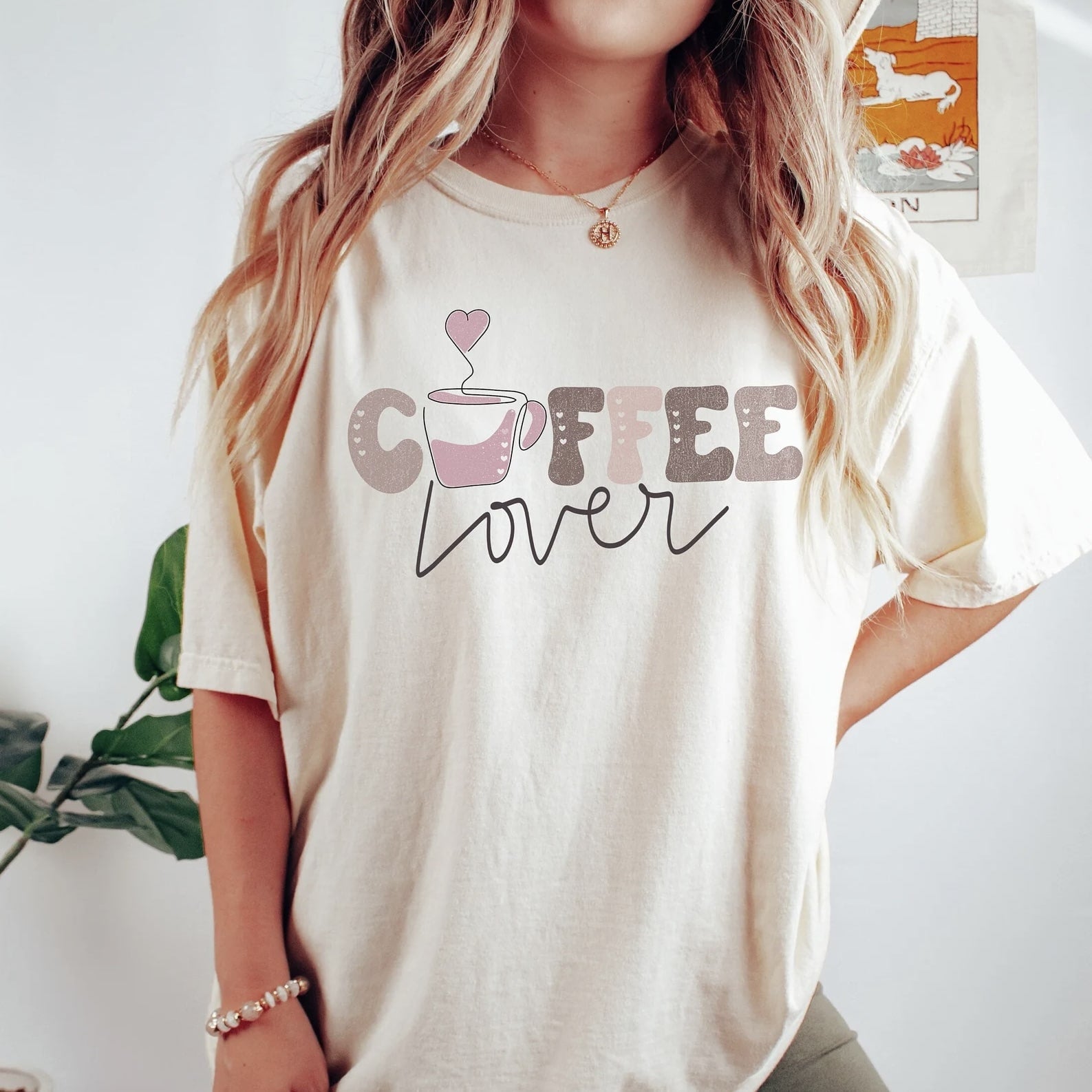 Cream 'Coffee Lover' t - shirt featuring coffee - cup and text.