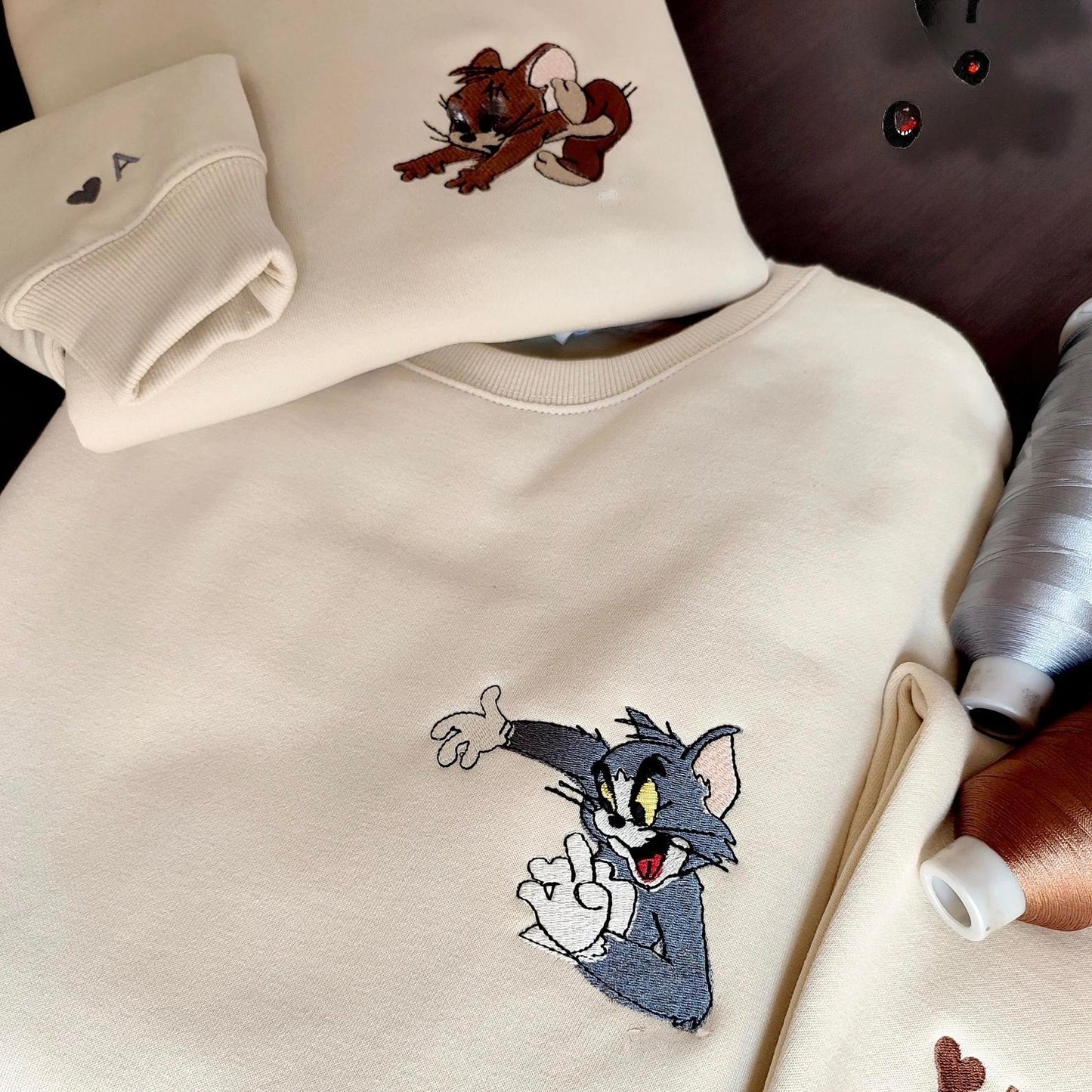 Matching Couple Hoodies offering custom couple hoodies with classic Tom & Jerry characters.
