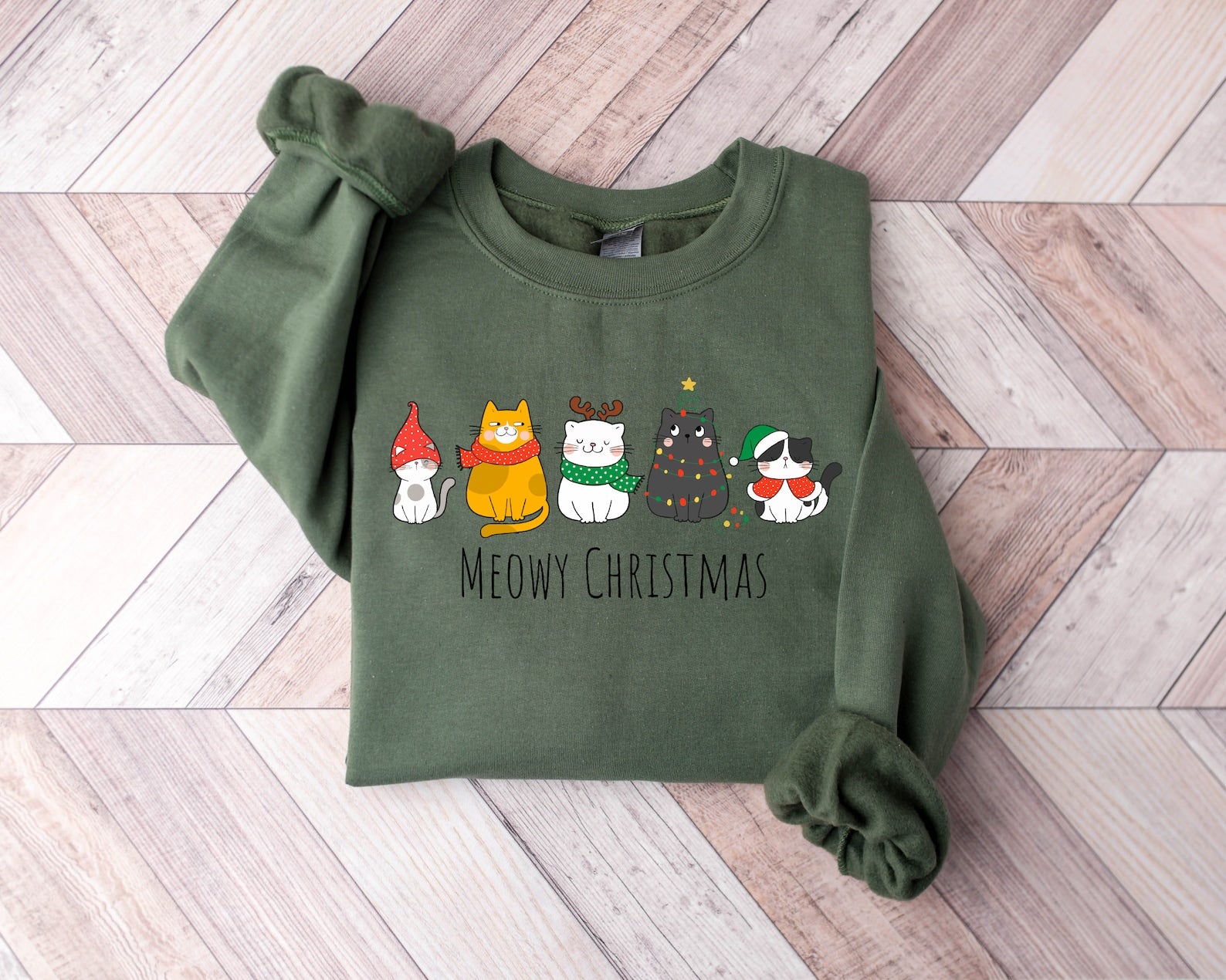 Cozy "Meowy Christmas" sweatshirt with holiday-themed cat illustrations
