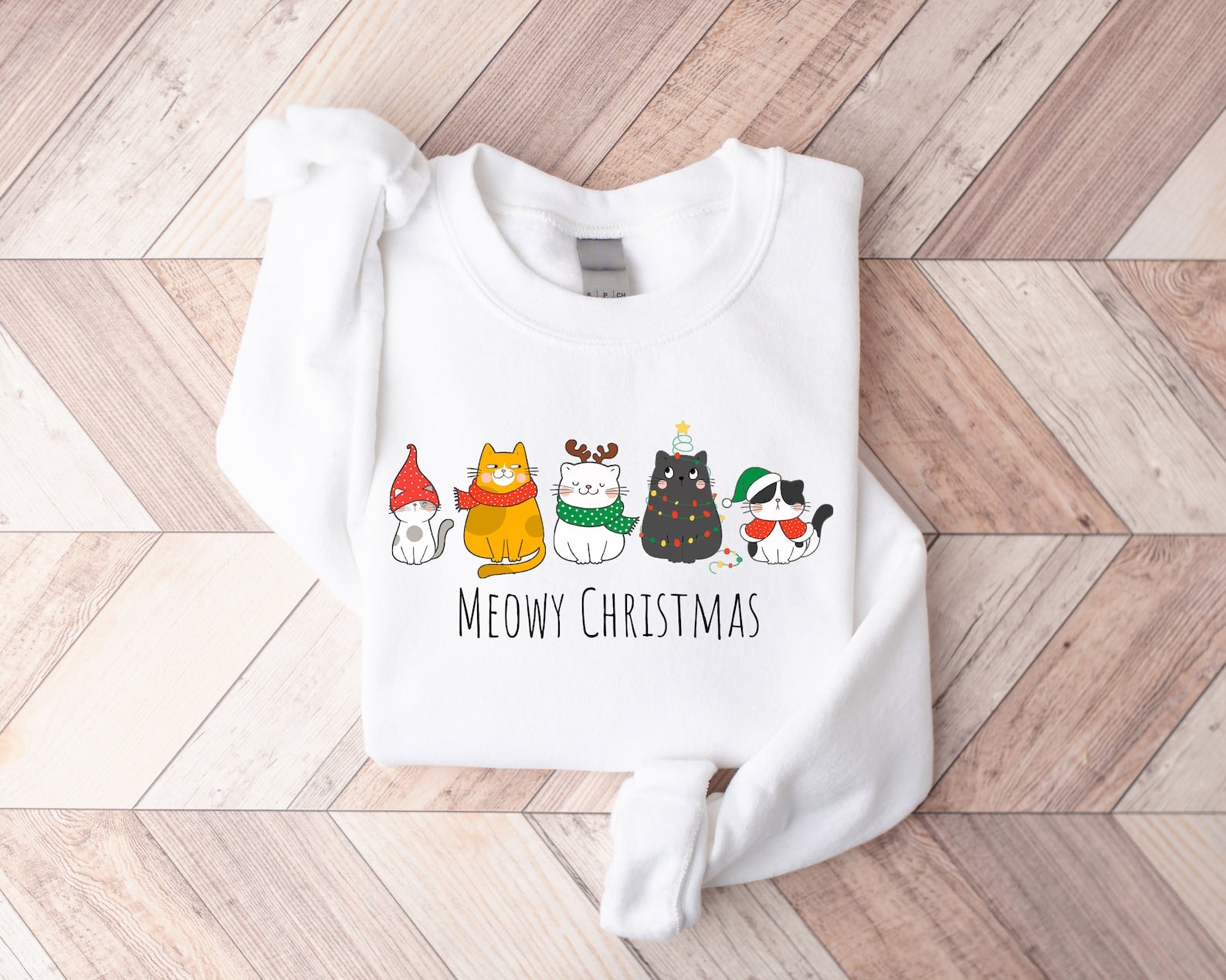 "Meowy Christmas" cat sweatshirt with festive holiday design
