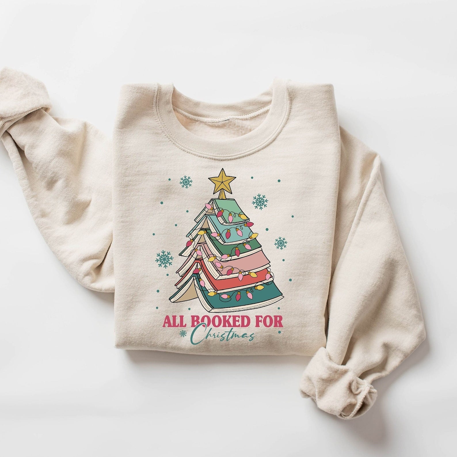 "All Booked for Christmas" sweatshirt with festive book tree design
