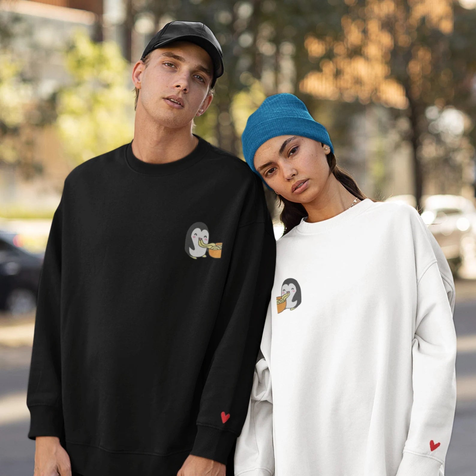 Matching Couple Hoodies crafted as custom couple hoodies with a charming penguin enjoying noodles.