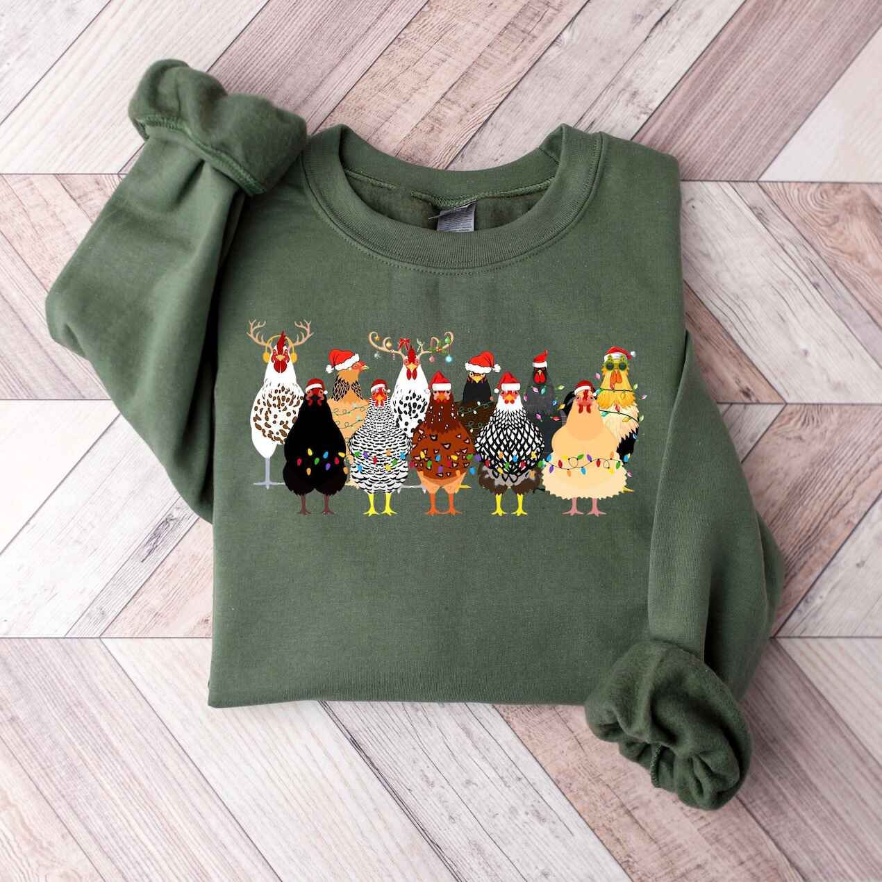 Cozy holiday sweatshirt featuring colorful chickens in Christmas hats
