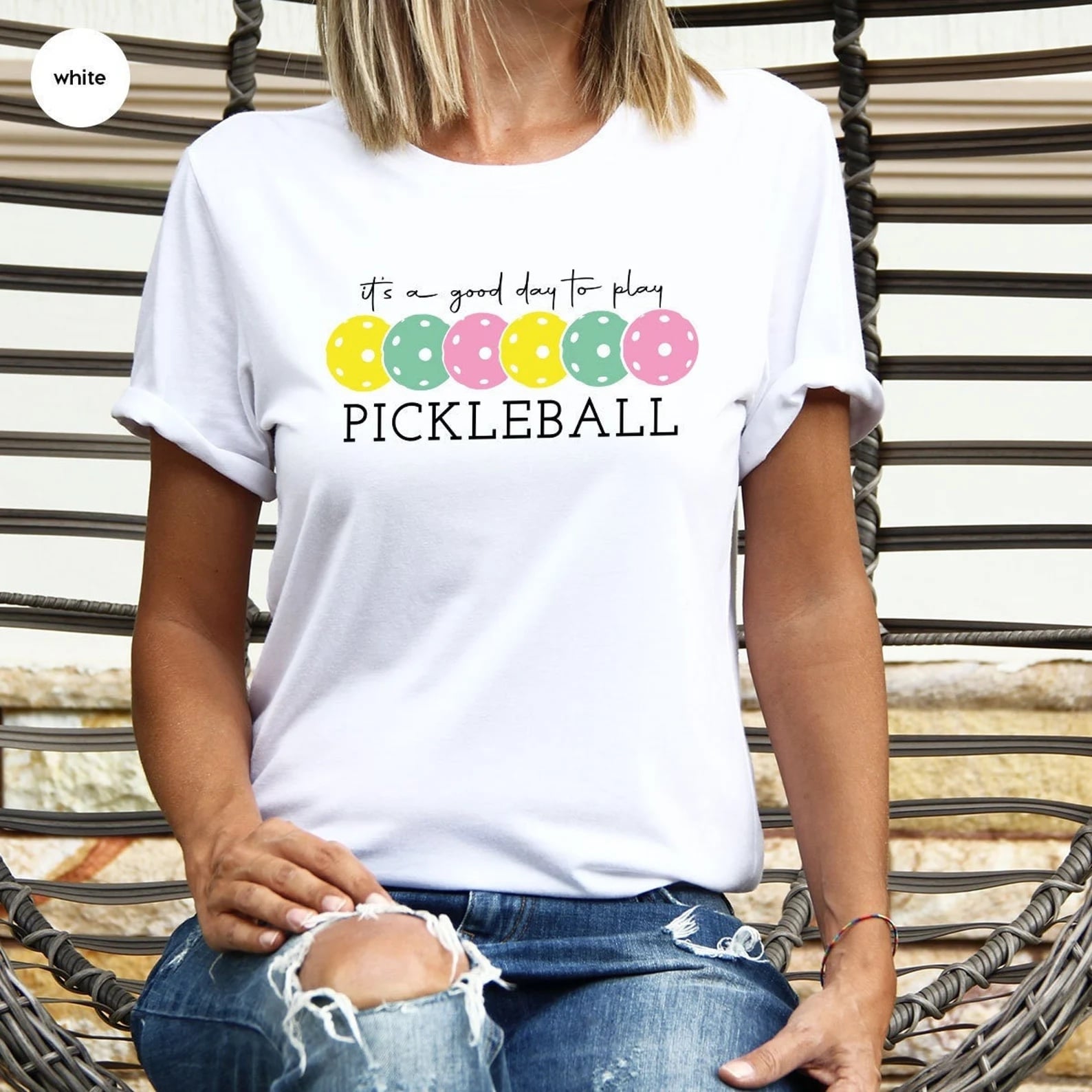 White t - shirt with colorful pickleball illustrations and 'It's a Good Day to Play Pickleball' text