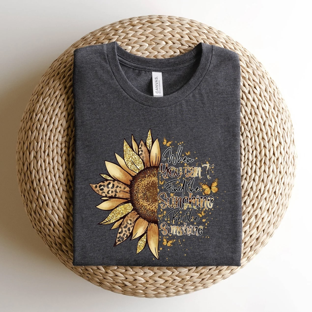 Sunflower graphic t-shirt in beige with gold and black print, showcasing a positive, nature-inspired message