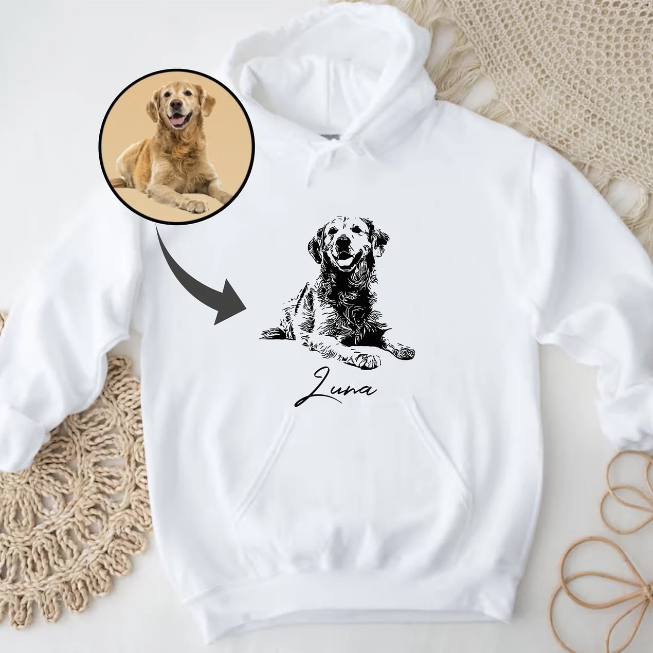 Personalized hoodie featuring pet artwork and name.