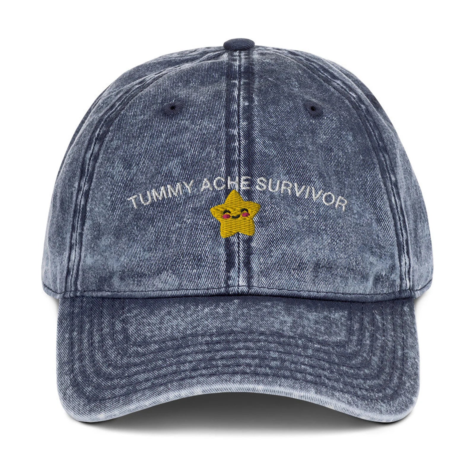 Vintage-washed blue "Tummy Ache Survivor" cap with embroidered design