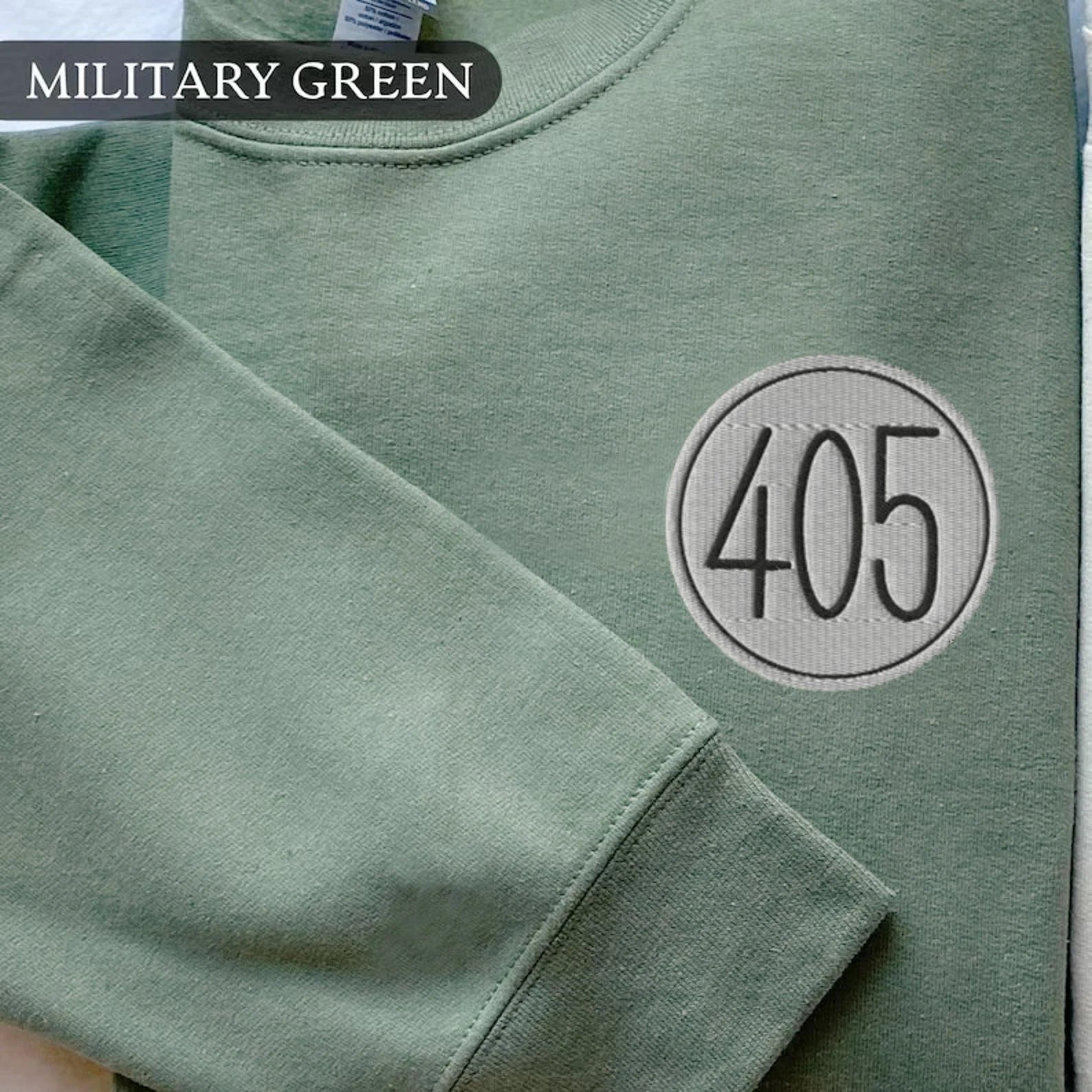 Close-up of "405" and "99" matching designs on cozy sweatshirts.