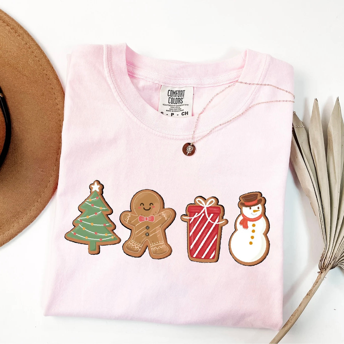 Soft Christmas tee with cute gingerbread cookie holiday designs.