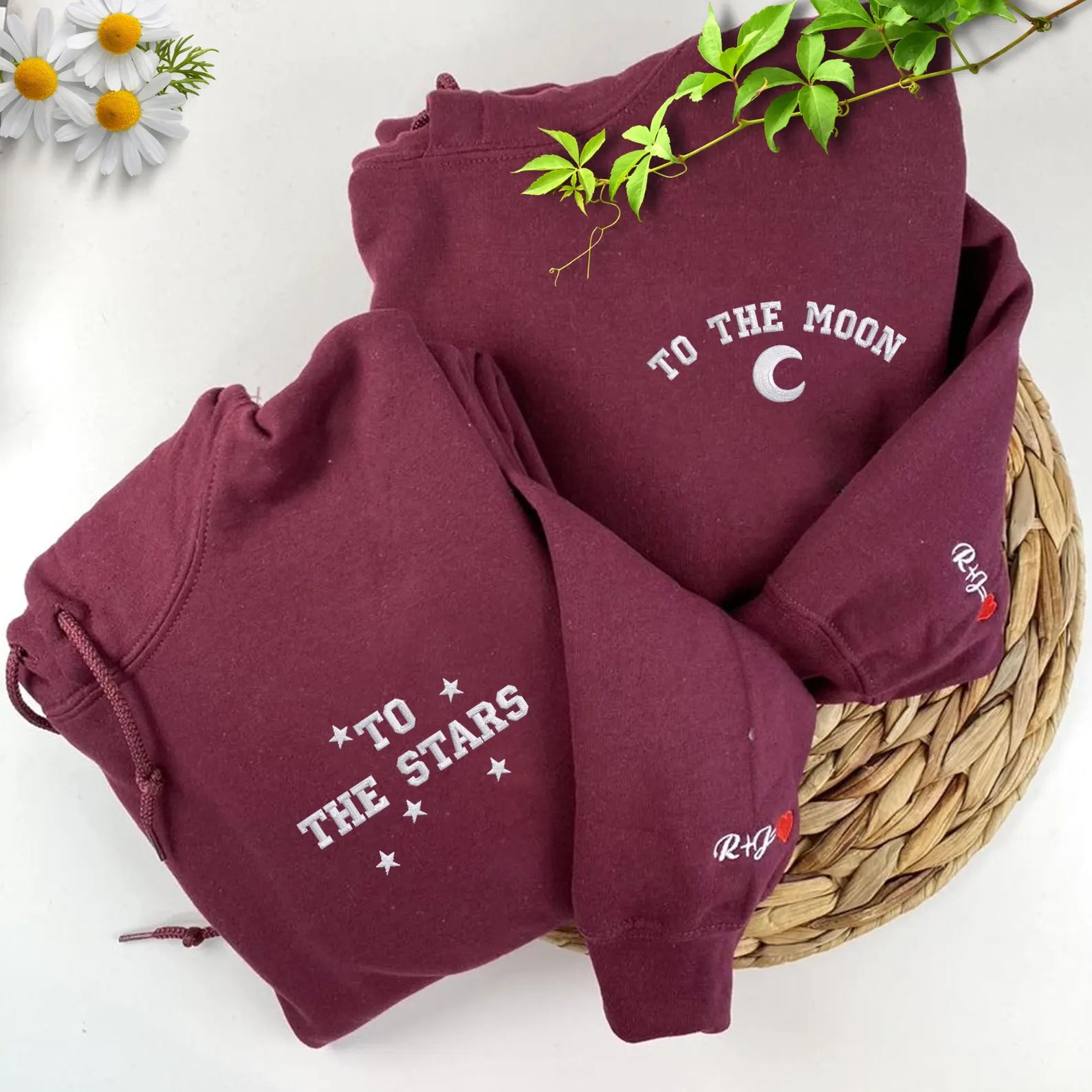 Close-up of embroidered text on cozy matching hoodies.