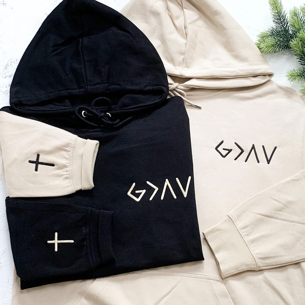 Minimalist faith-based hoodie with G>∧∨ design