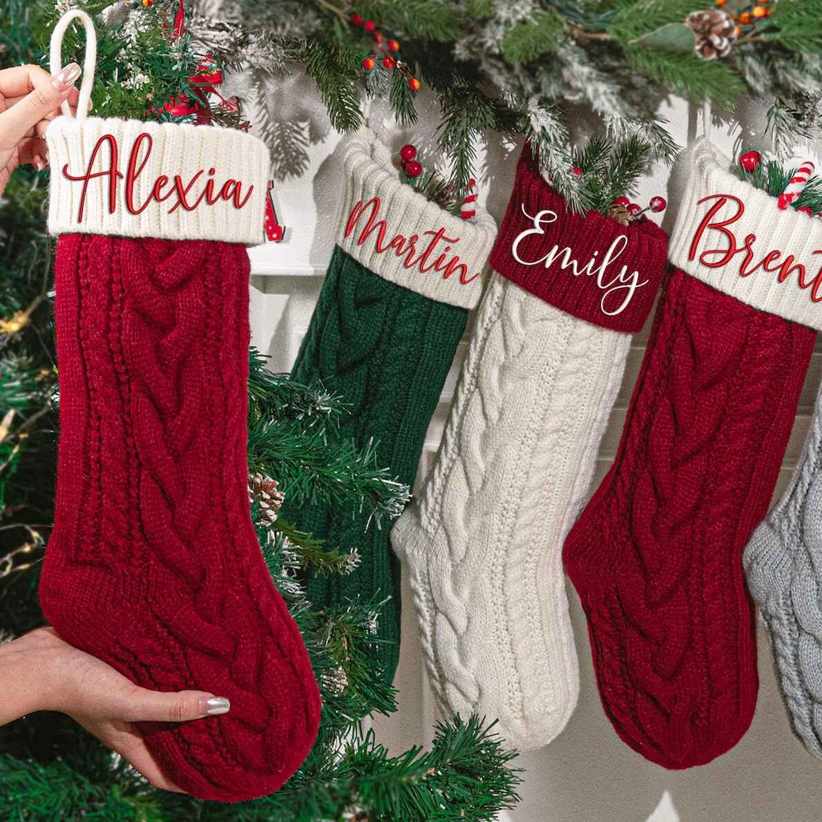 Custom knit Christmas stockings with family names, festive colors.
